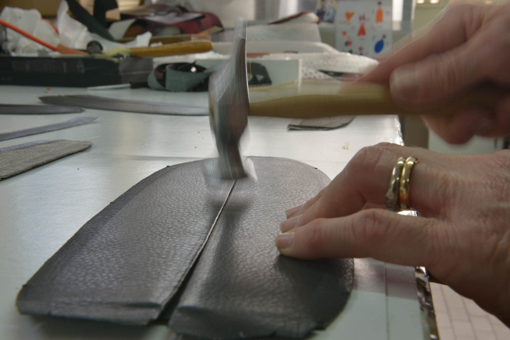 Leather work in the Schedoni factory.