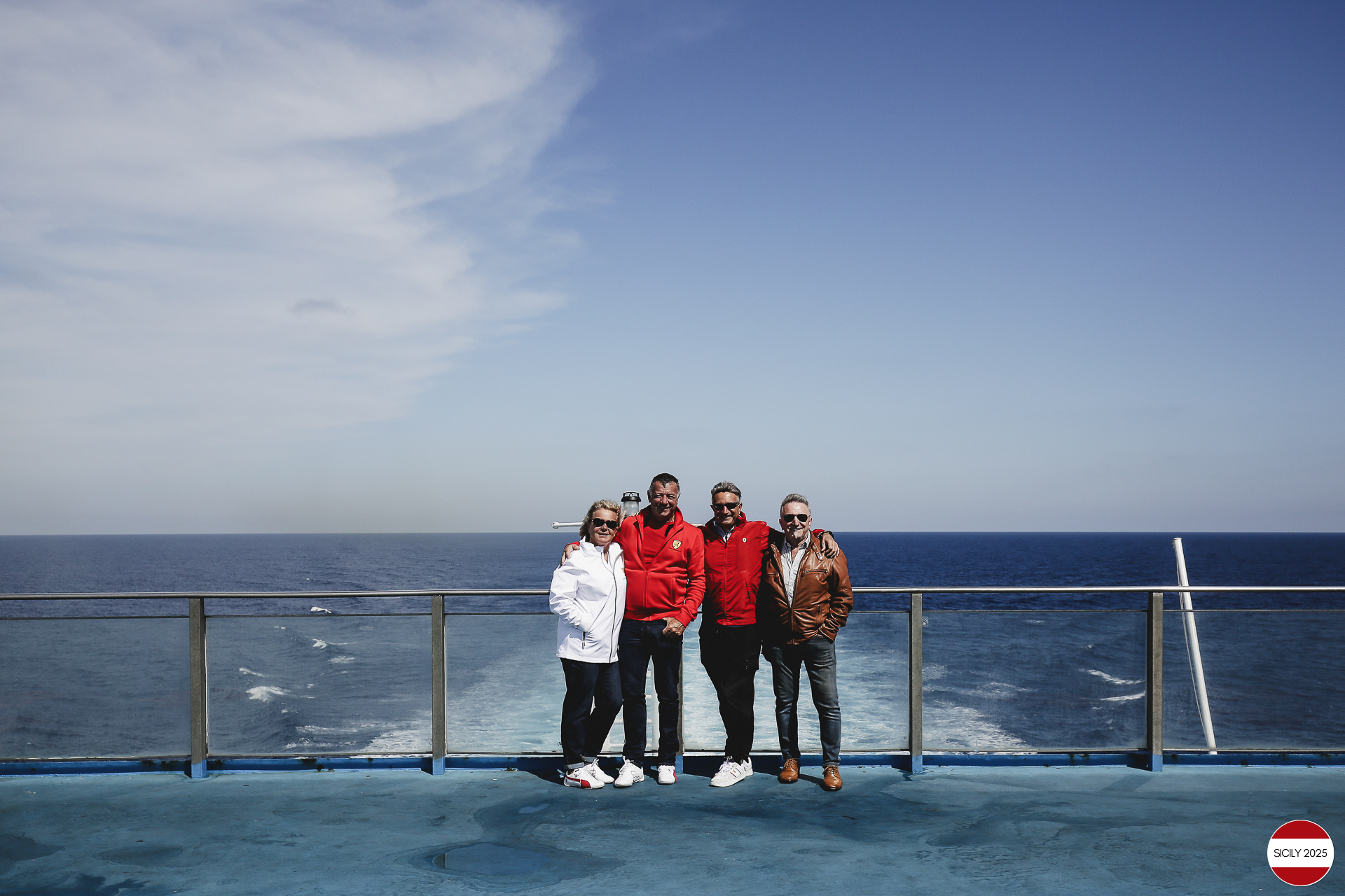 Ferrari drivers and their partners relax on the ship as it sails towards Palermo. 