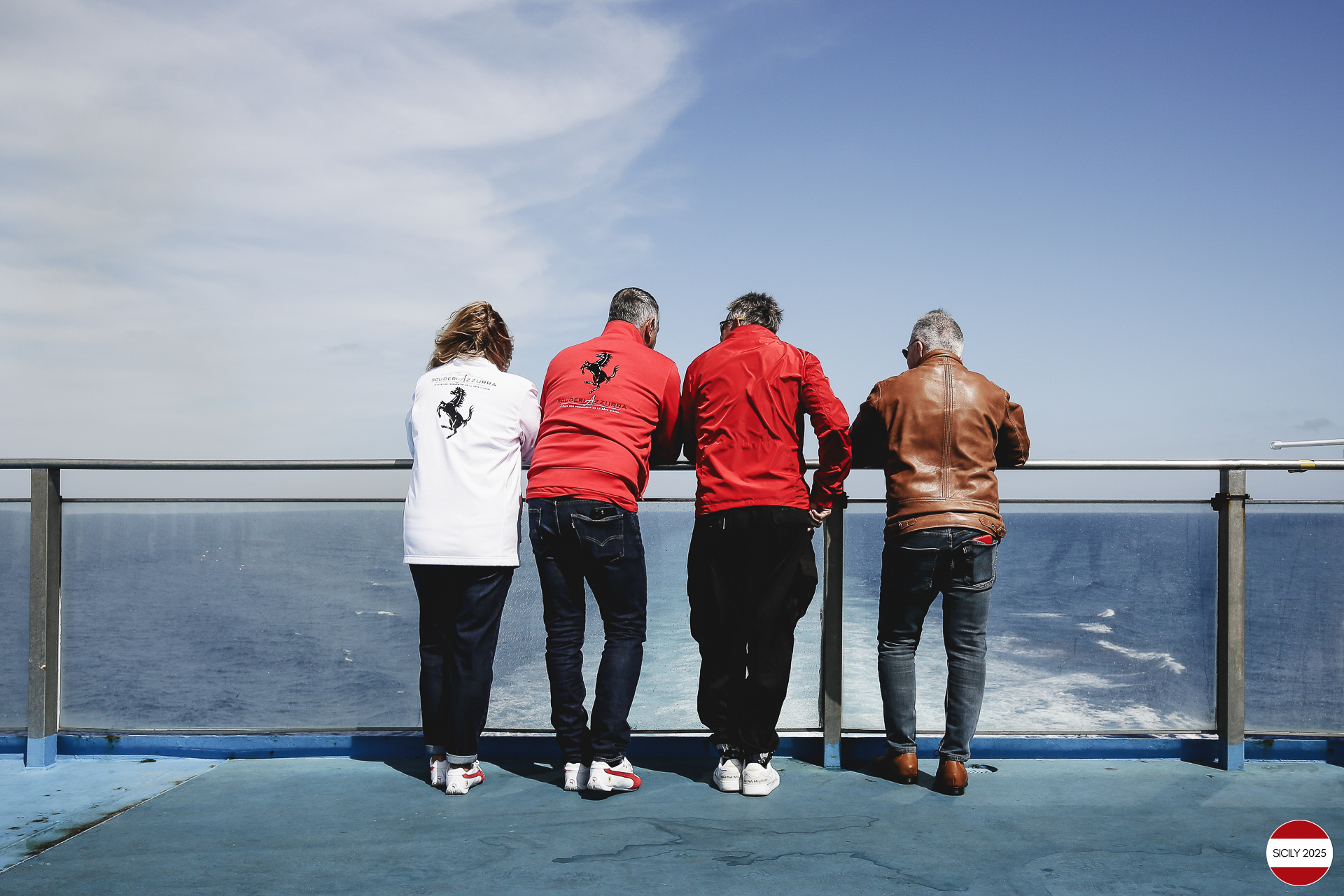 Ferrari drivers and their partners relax on the ship as it sails towards Palermo. 
