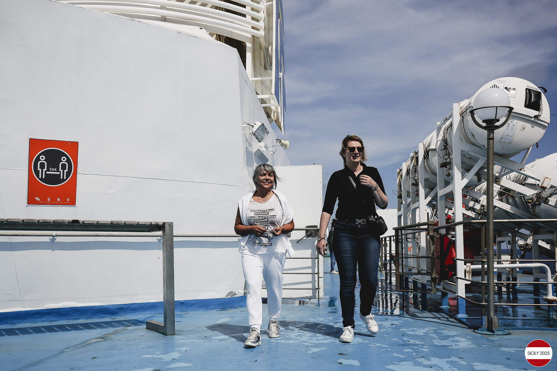 Ferrari drivers and their partners relax on the ship as it sails towards Palermo. 