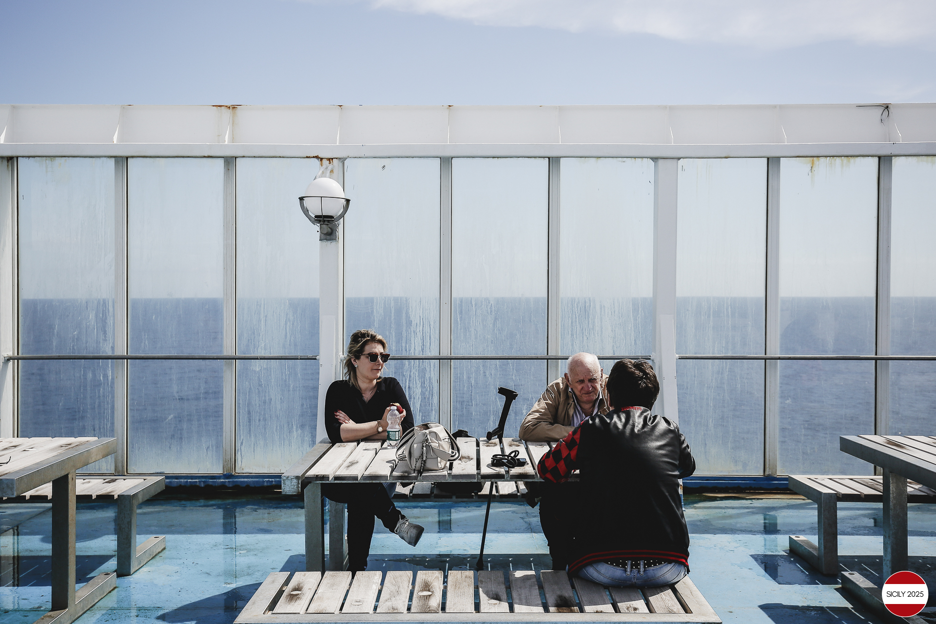 Ferrari drivers and their partners relax on the ship as it sails towards Palermo. 