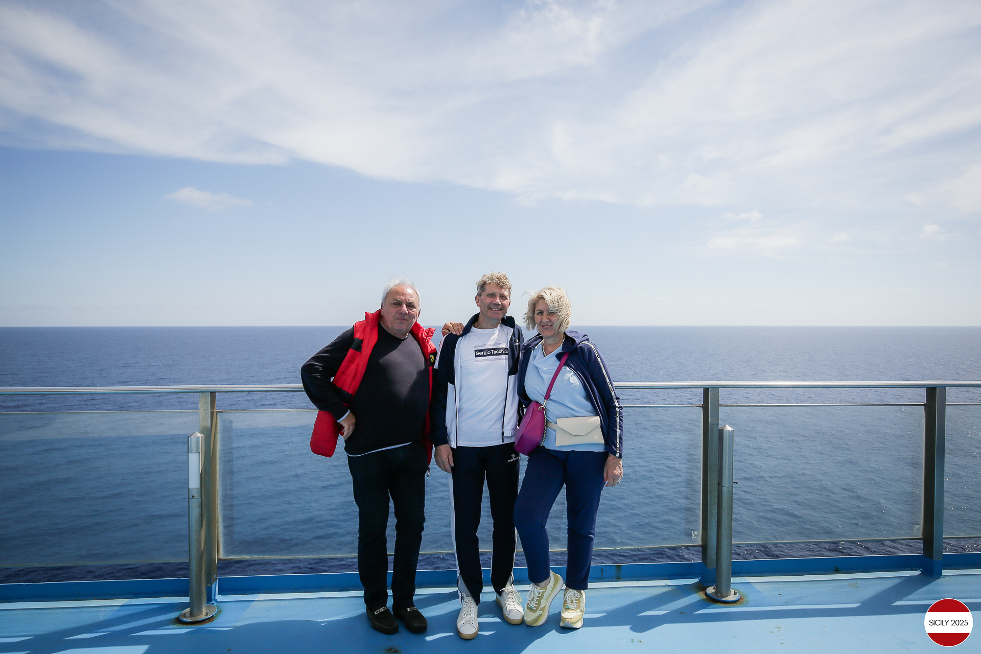 Ferrari drivers and their partners relax on the ship as it sails towards Palermo. 