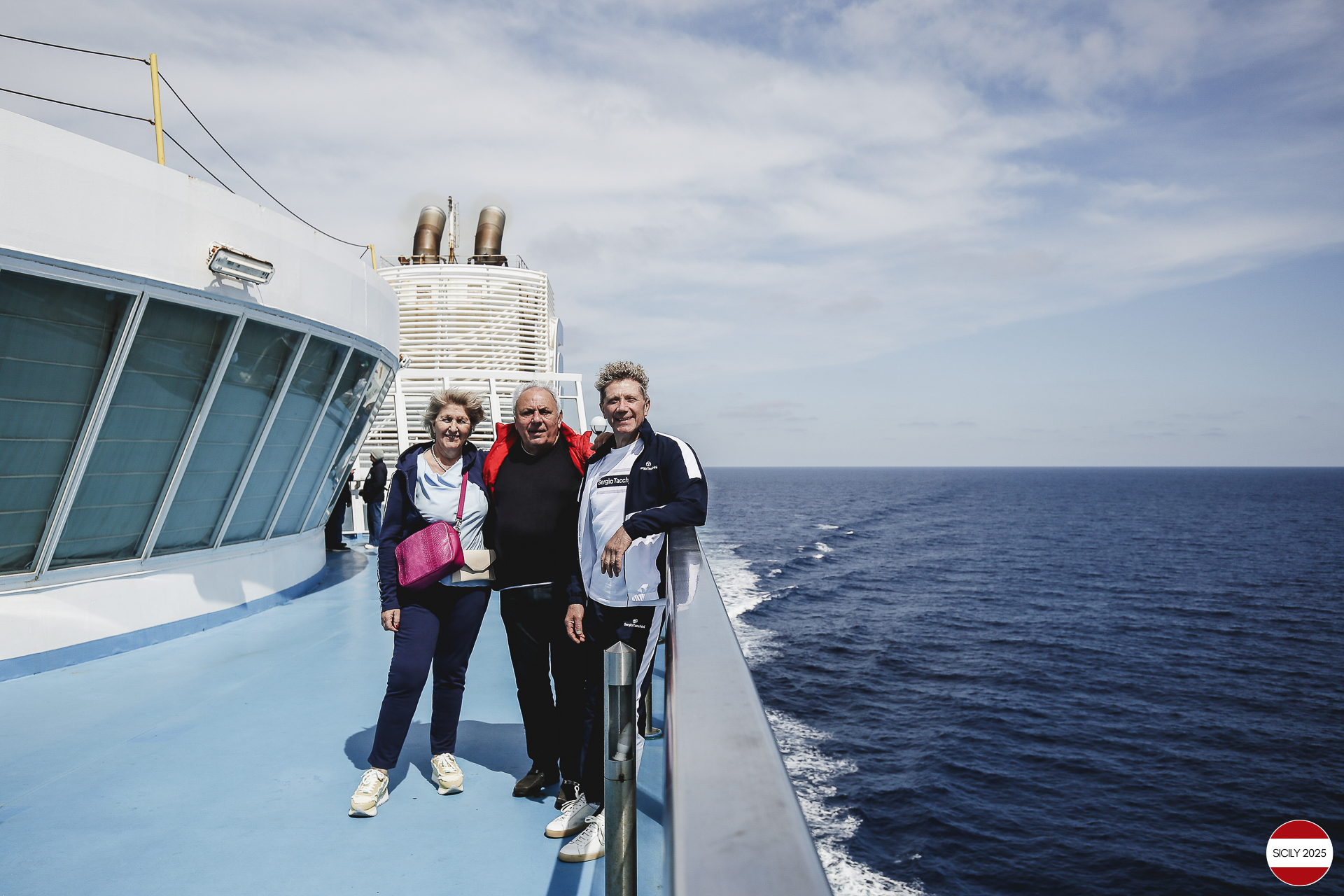 Ferrari drivers and their partners relax on the ship as it sails towards Palermo. 