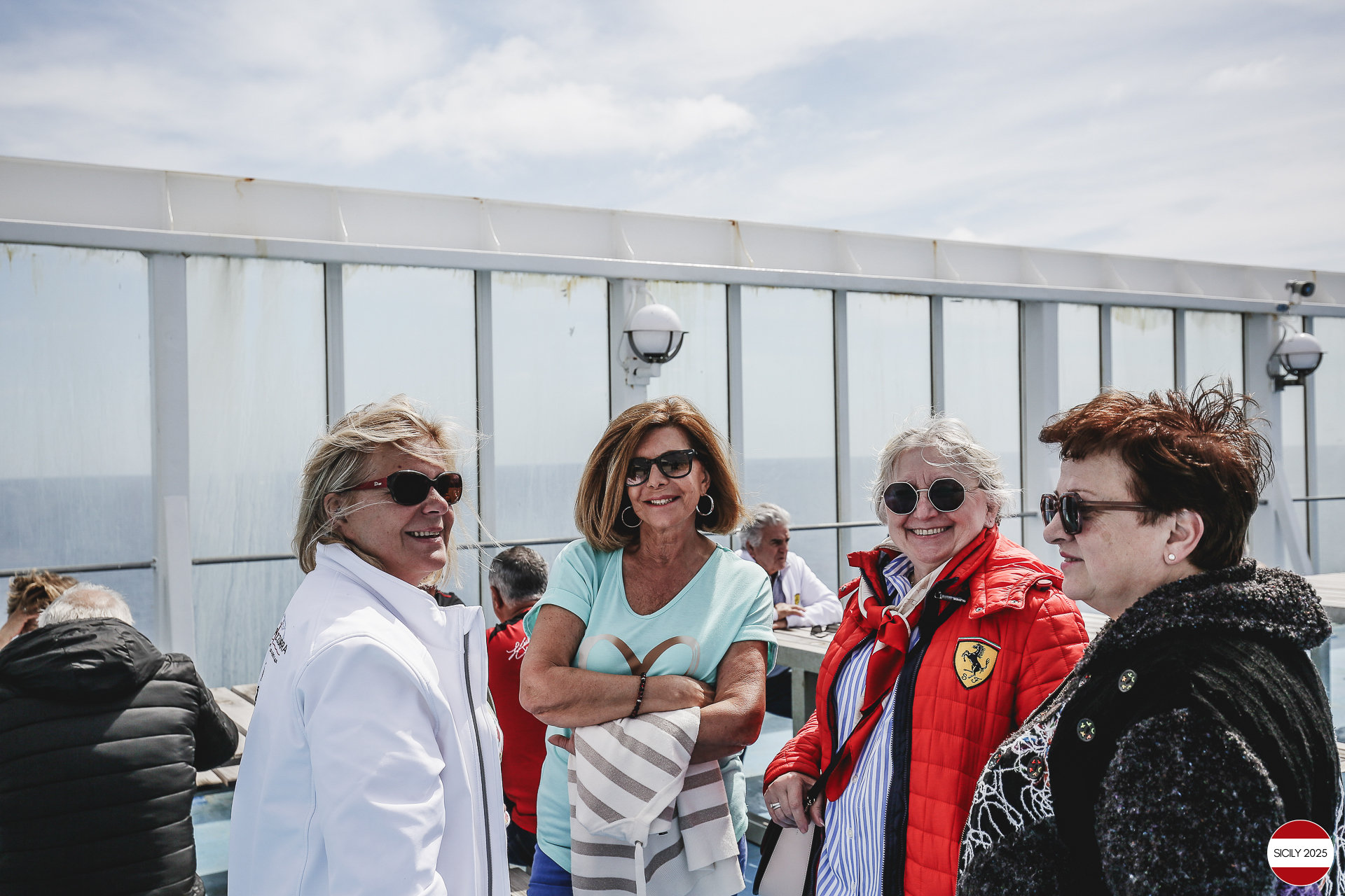 Ferrari drivers and their partners relax on the ship as it sails towards Palermo. 