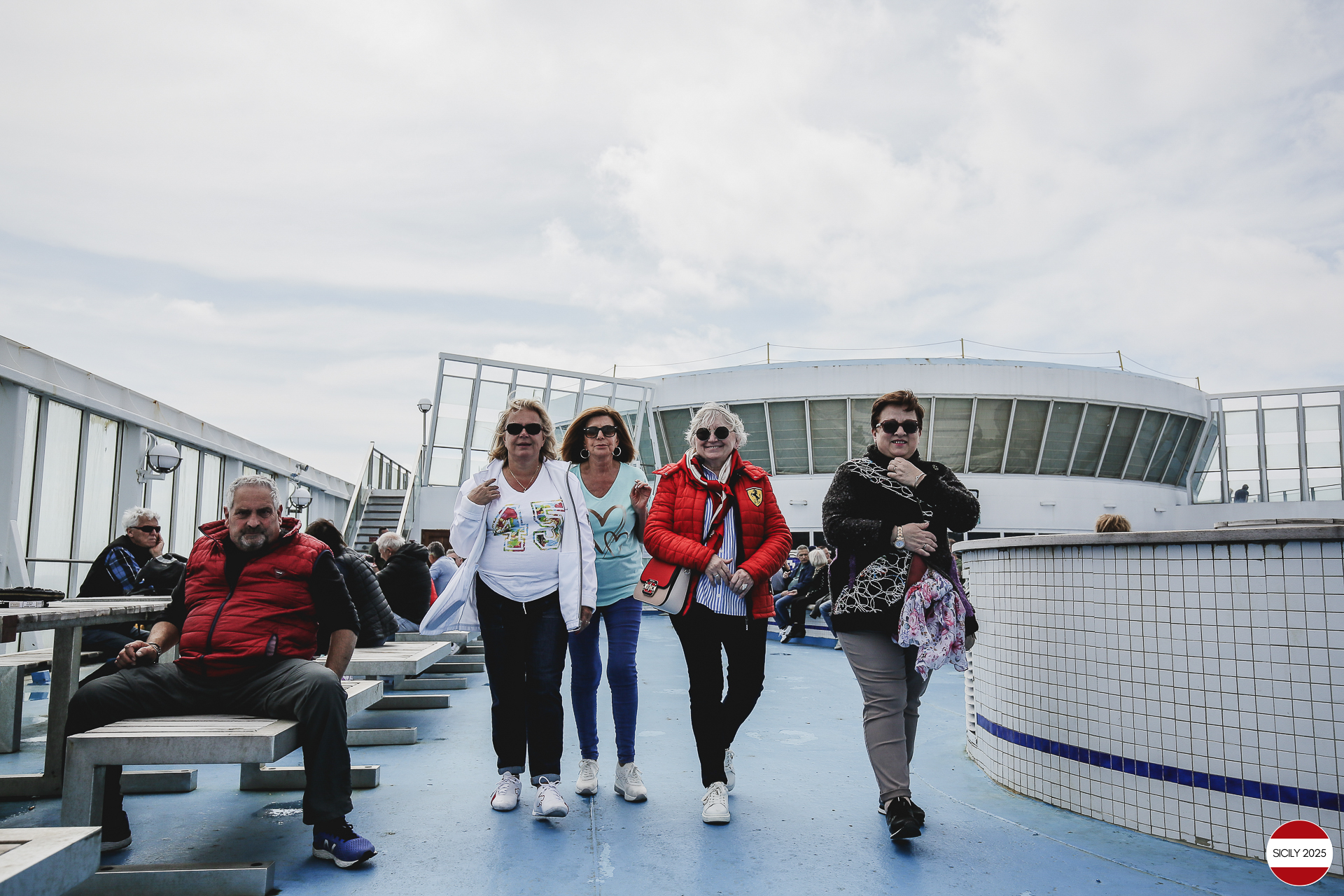 Ferrari drivers and their partners relax on the ship as it sails towards Palermo. 