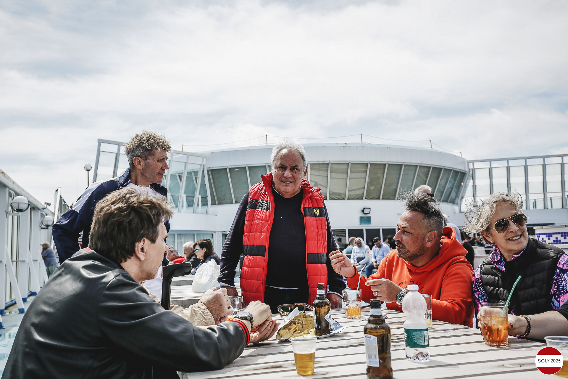 Ferrari drivers and their partners relax on the ship as it sails towards Palermo. 