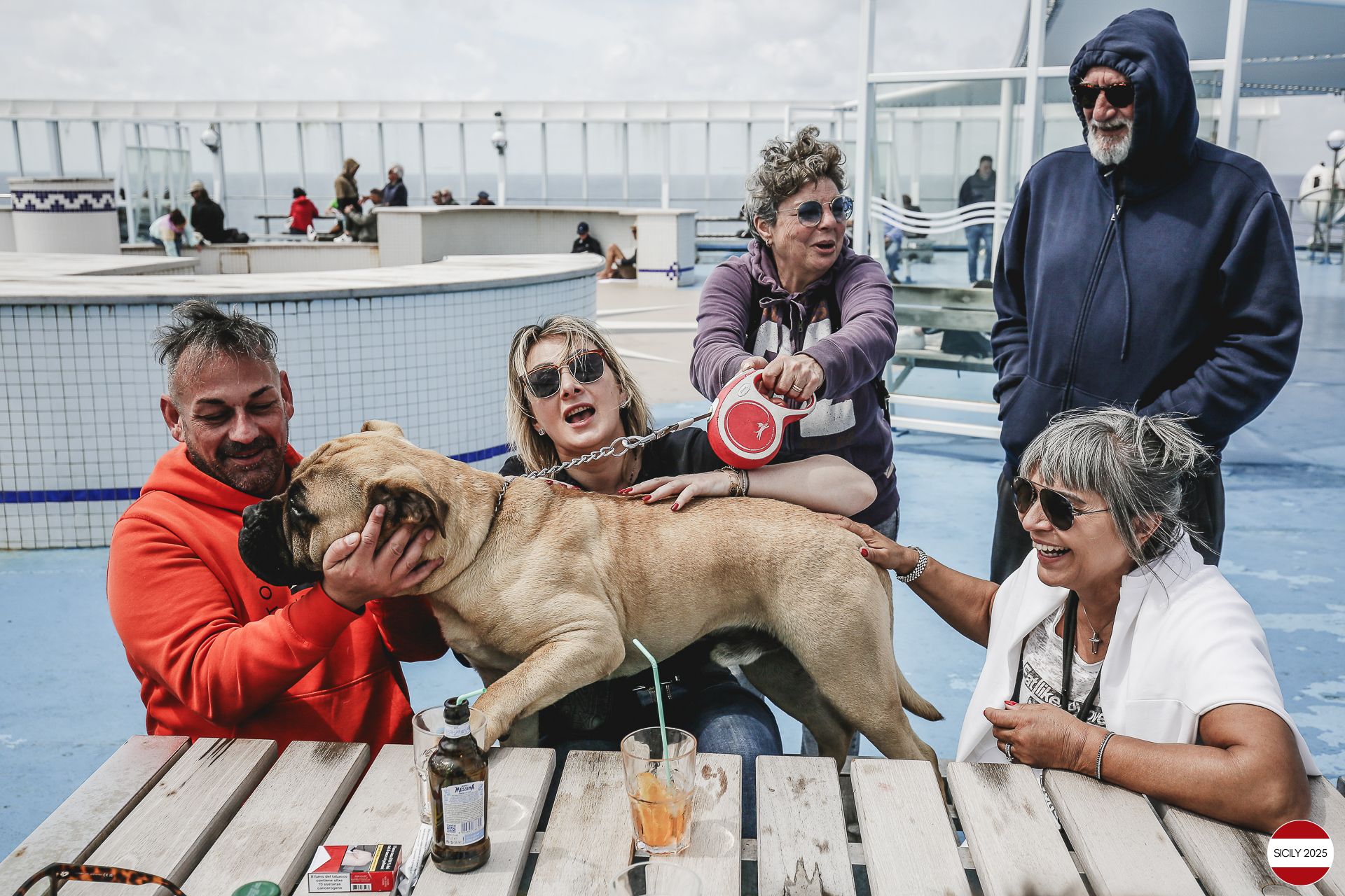 Ferrari drivers and their partners relax on the ship as it sails towards Palermo. 