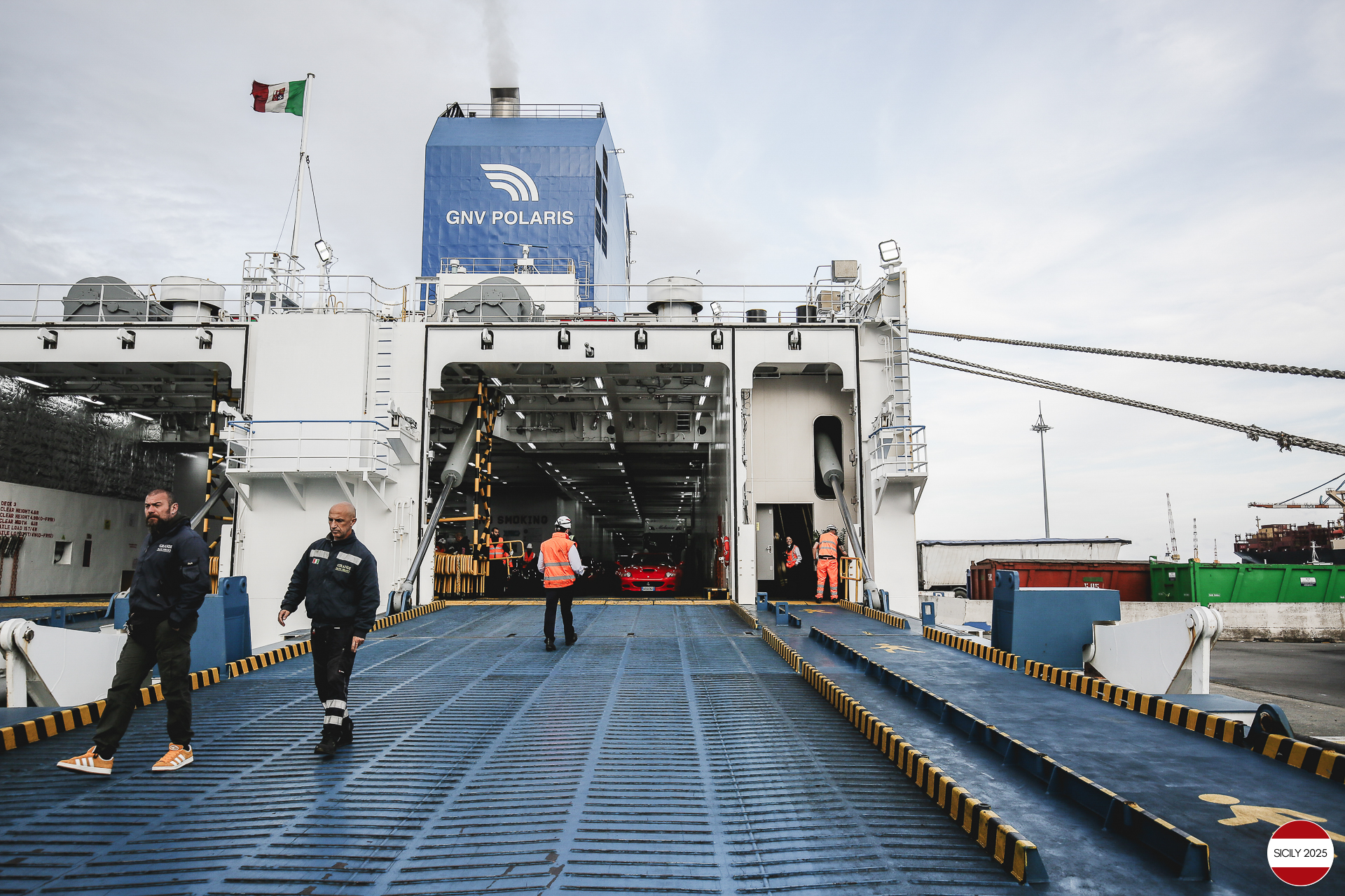 The cars disembark from the ship in Genoa. 