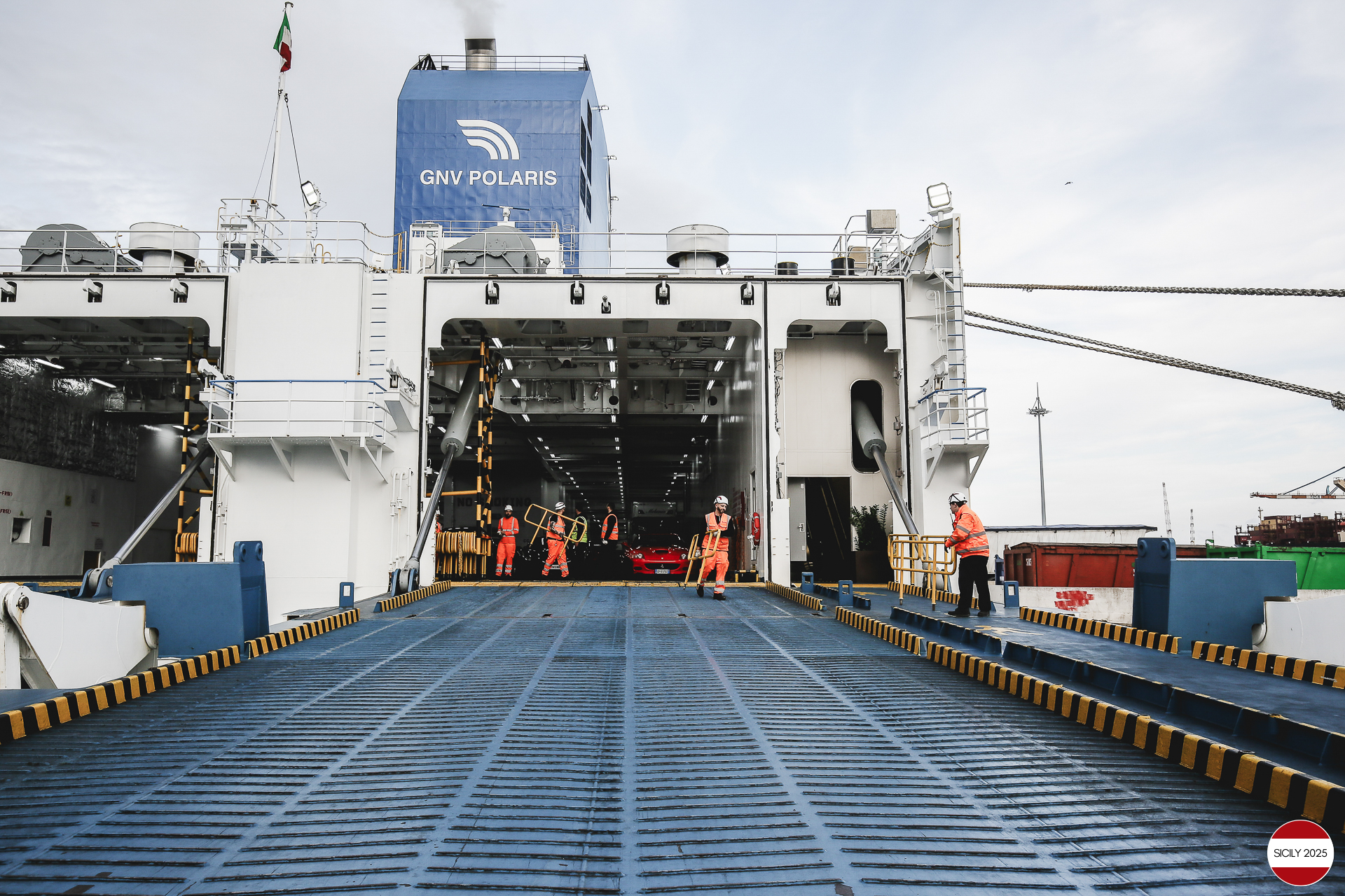 The cars disembark from the ship in Genoa. 