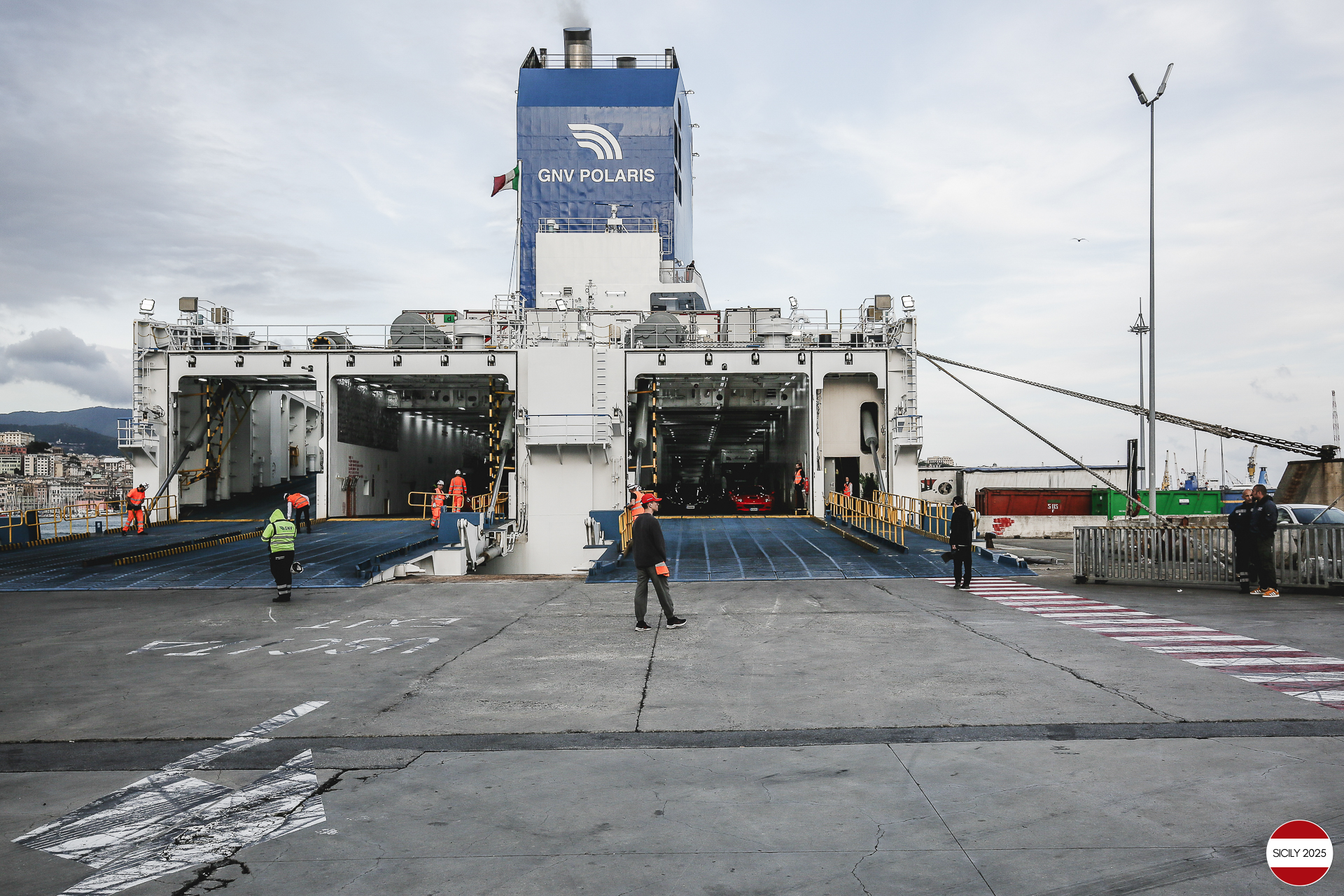 The cars disembark from the ship in Genoa. 