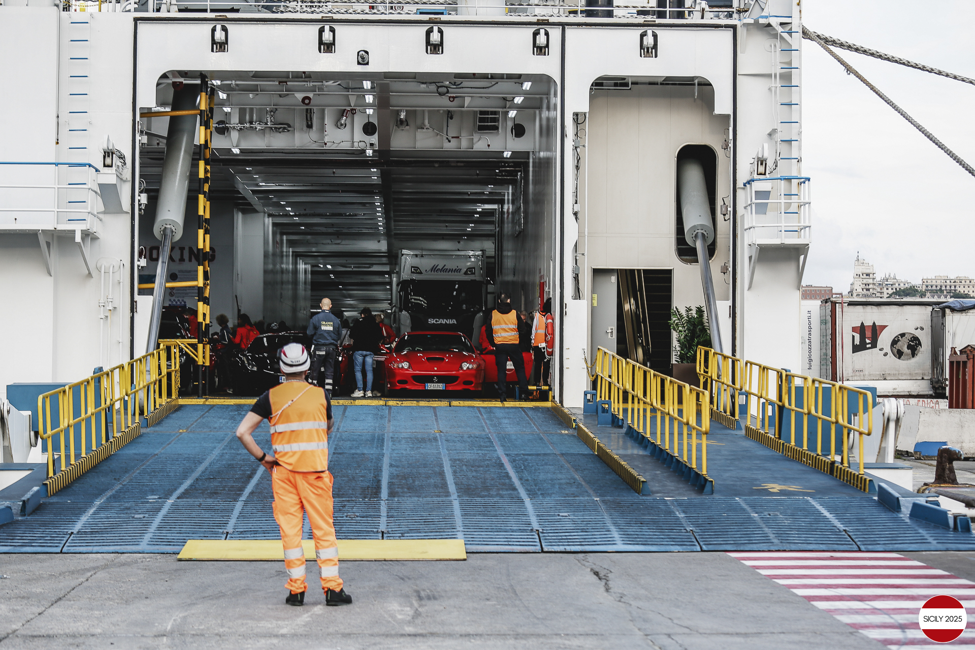 The cars disembark from the ship in Genoa. 