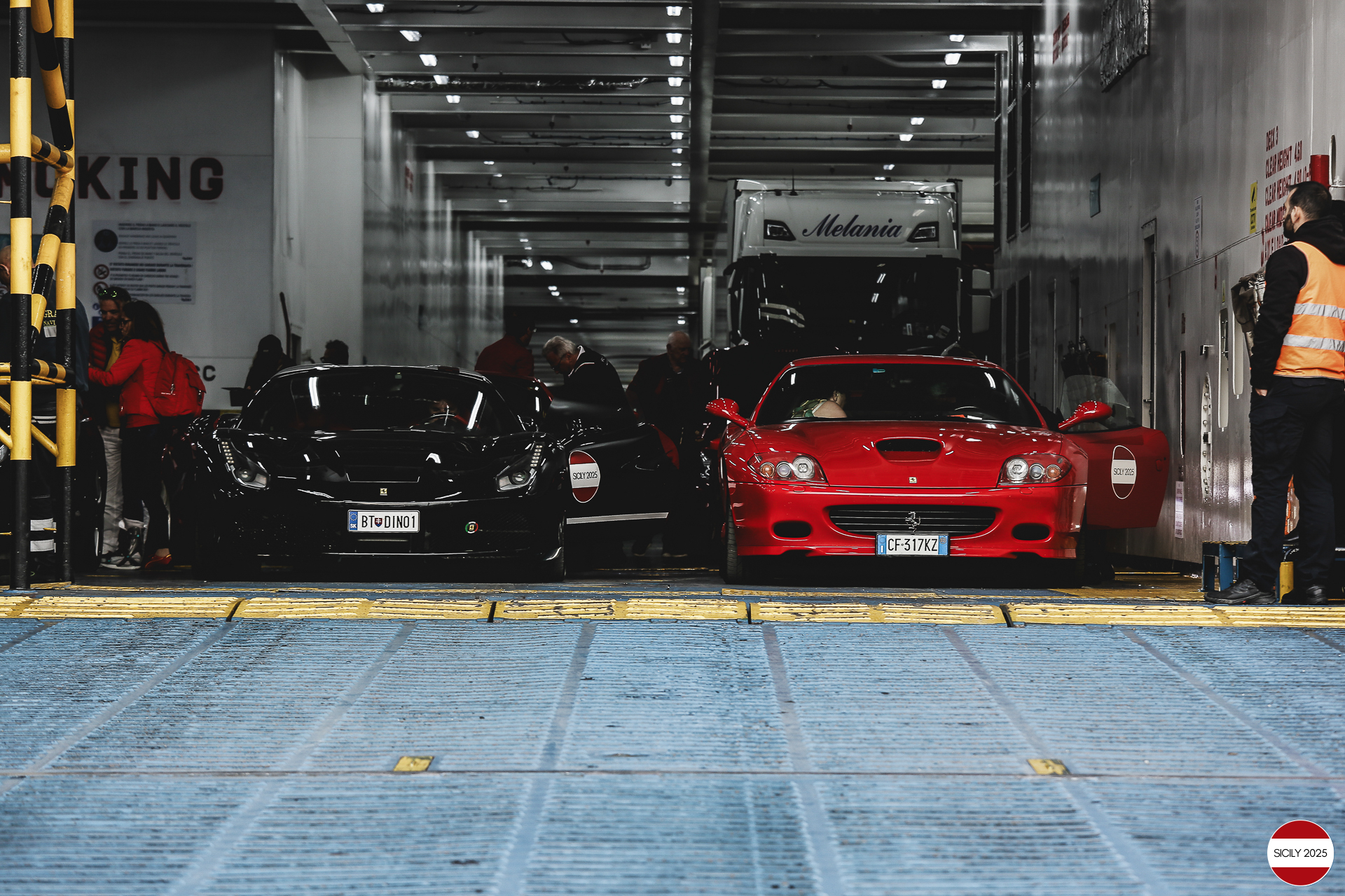 The cars disembark from the ship in Genoa. 