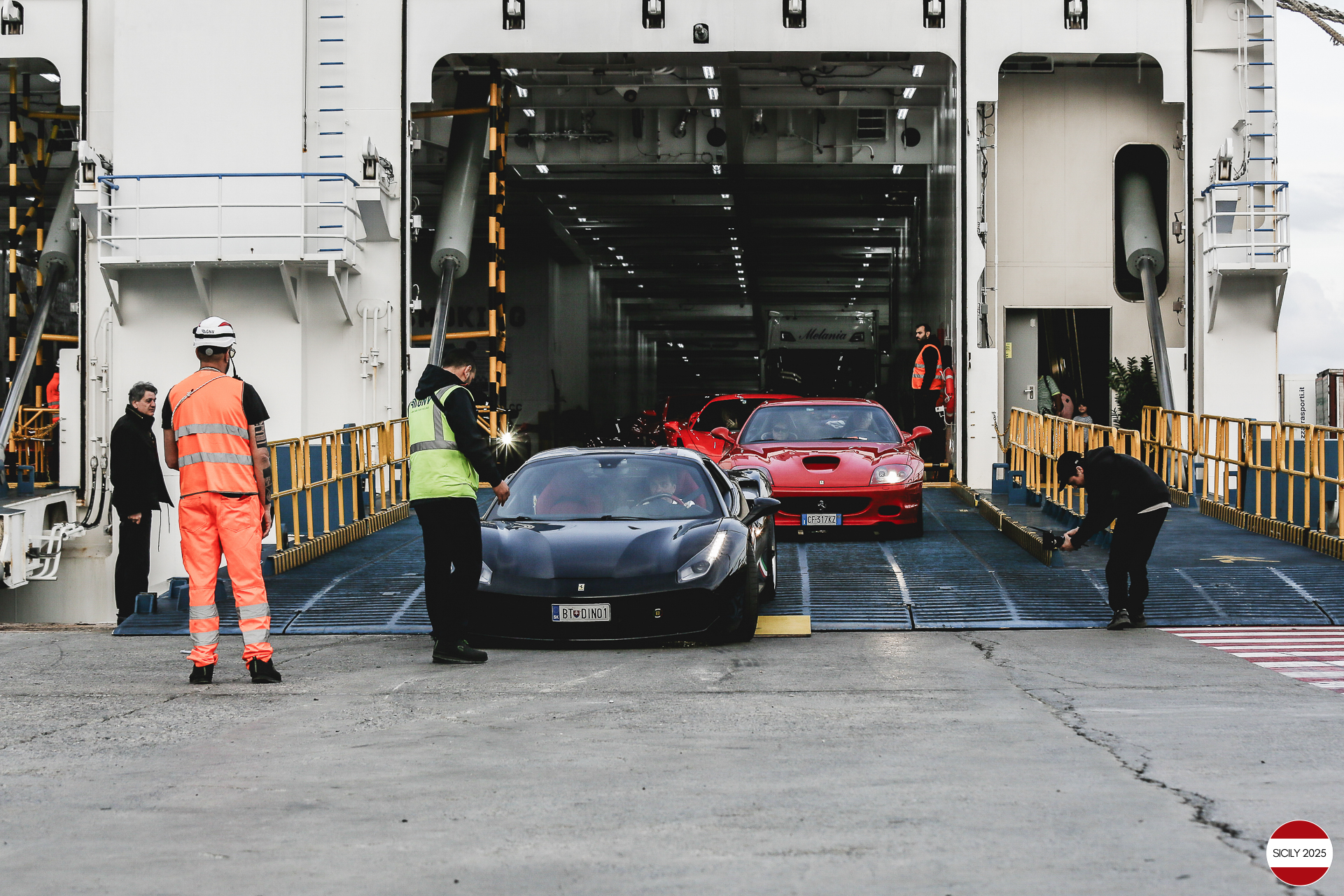 The cars disembark from the ship in Genoa. 