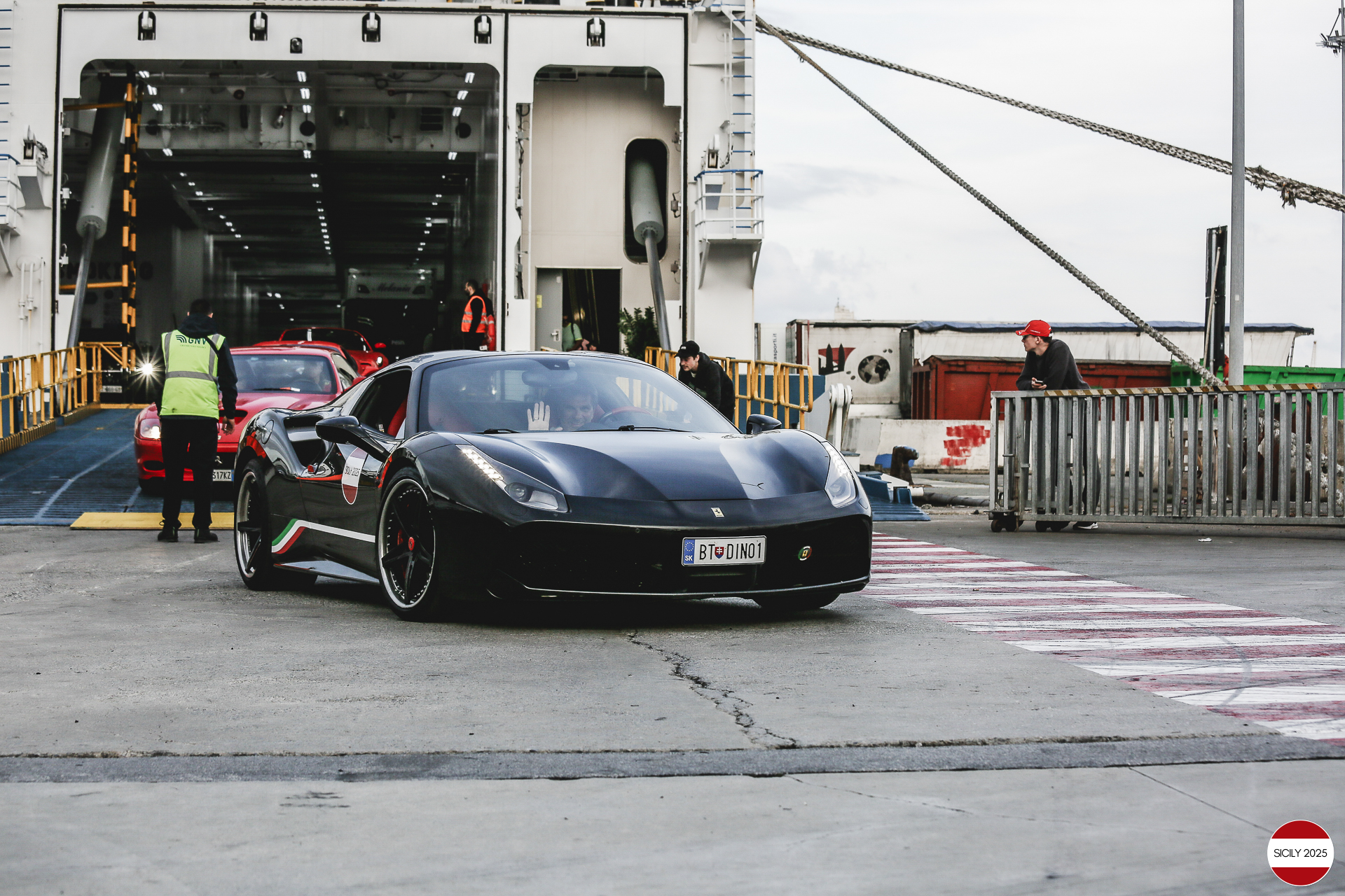 The cars disembark from the ship in Genoa. 