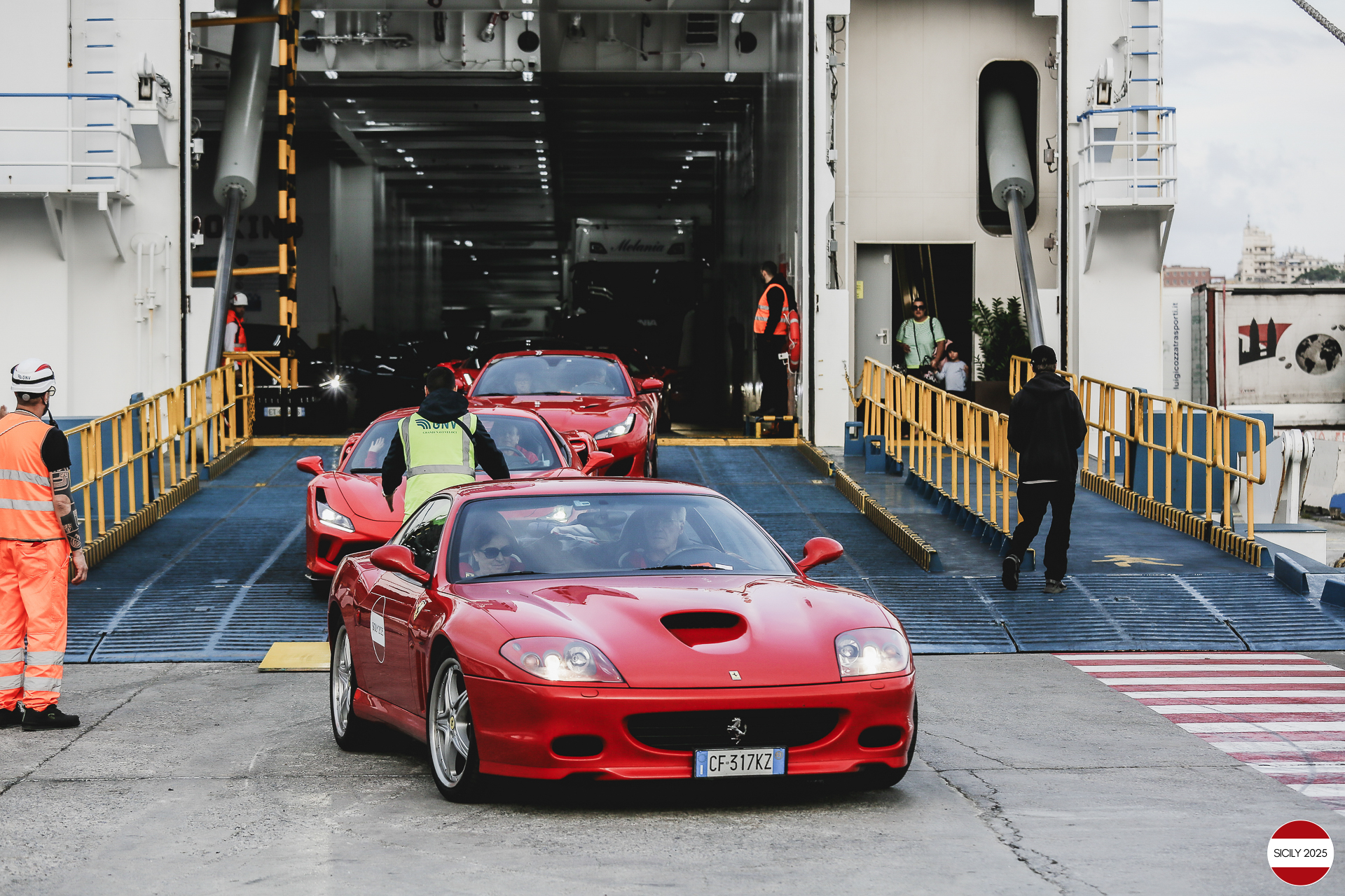 The cars disembark from the ship in Genoa. 