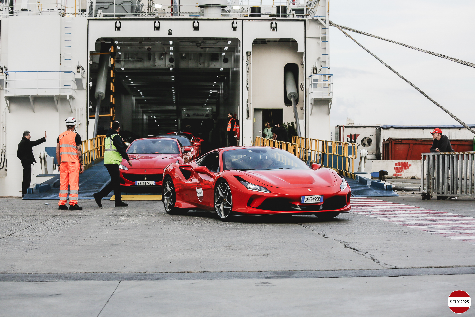 The cars disembark from the ship in Genoa. 
