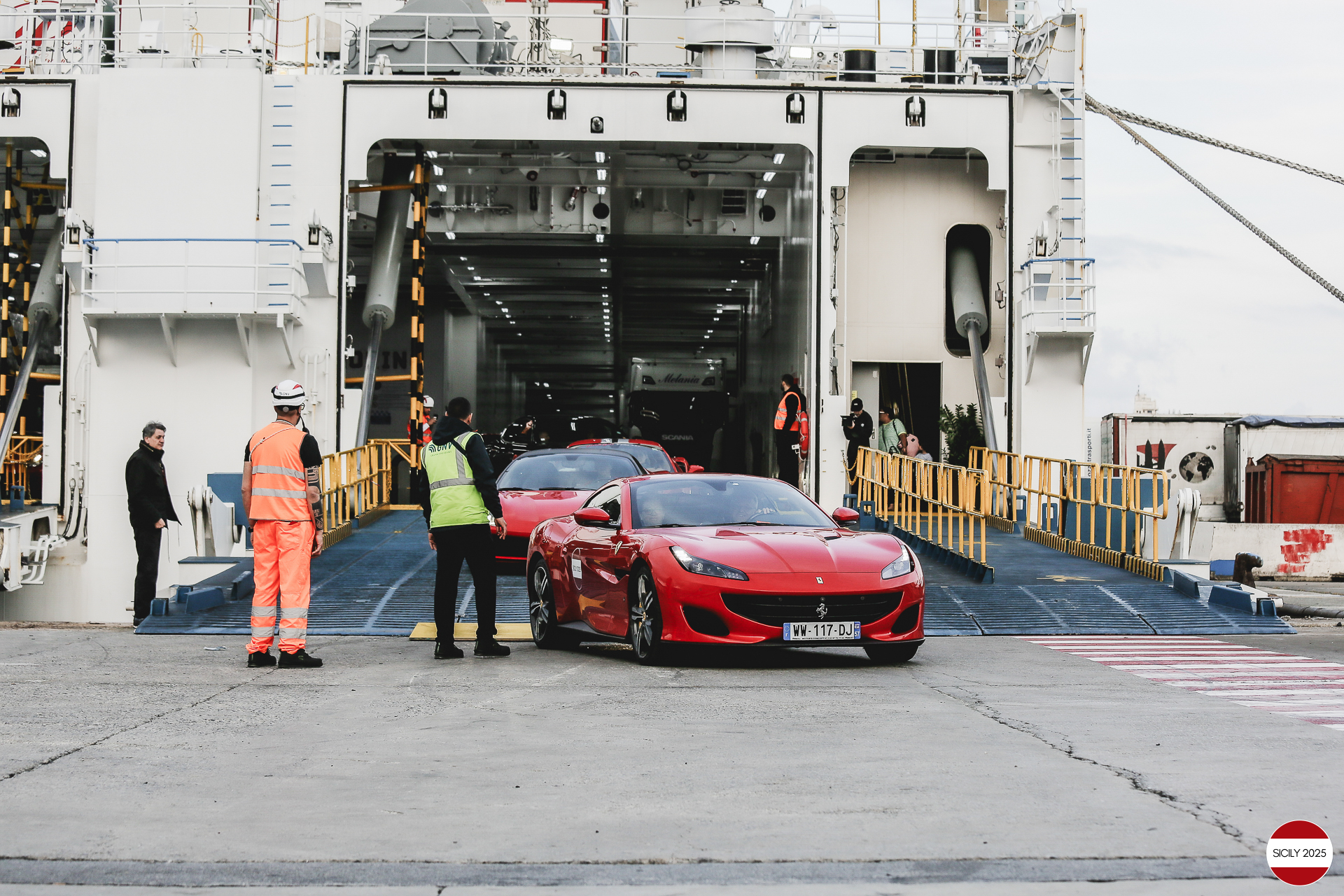 The cars disembark from the ship in Genoa. 