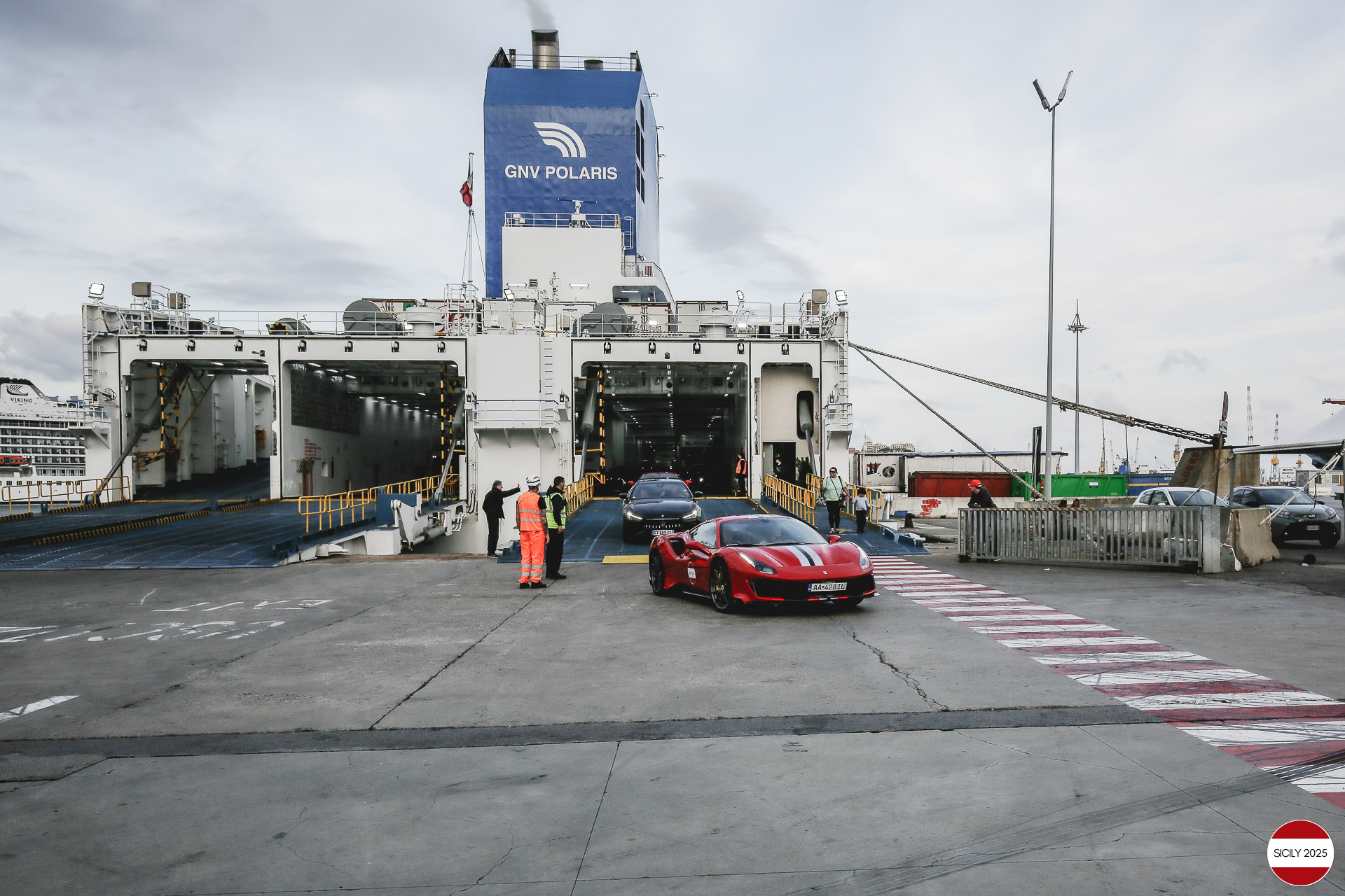 The cars disembark from the ship in Genoa. 