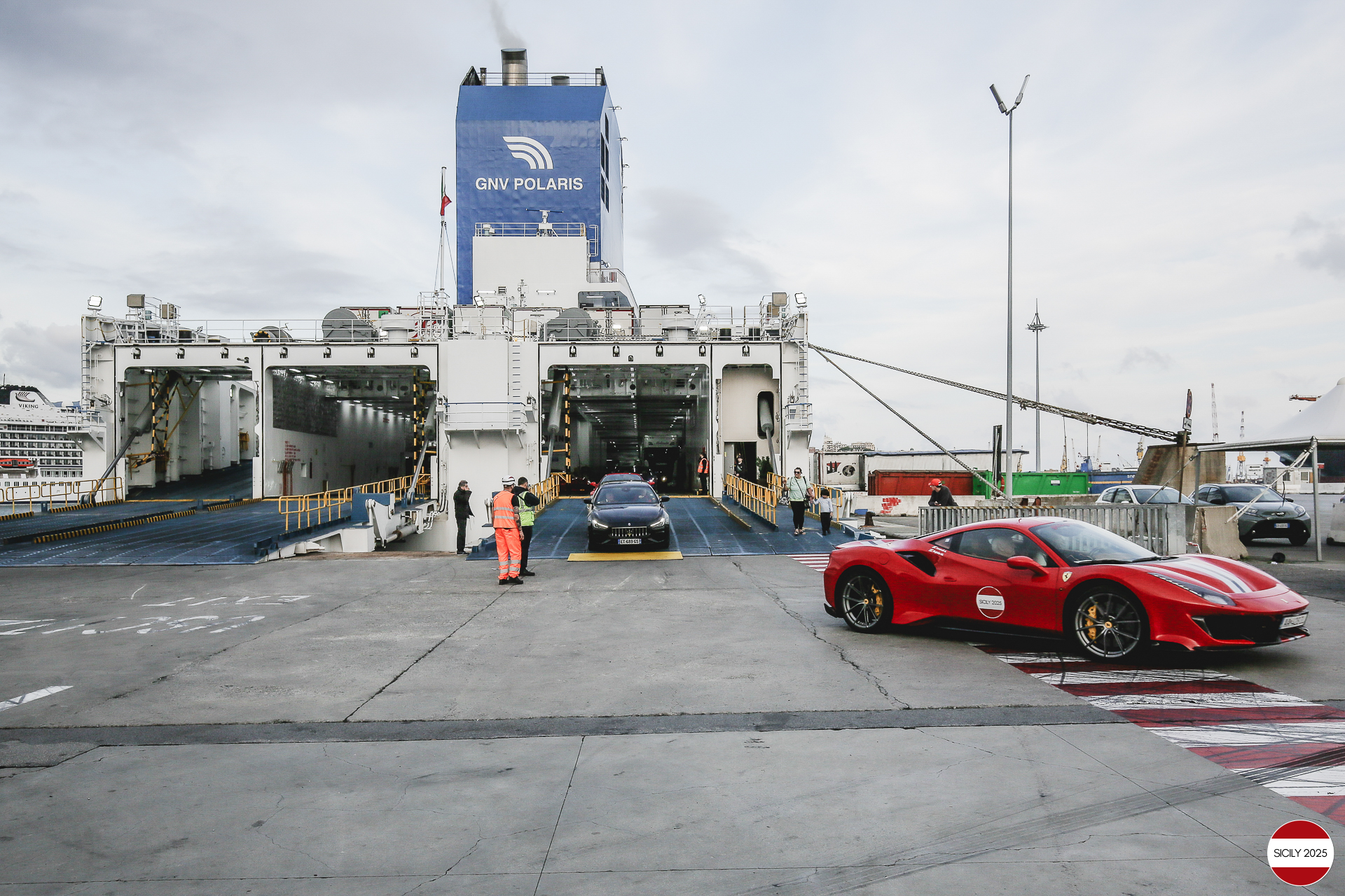 The cars disembark from the ship in Genoa. 