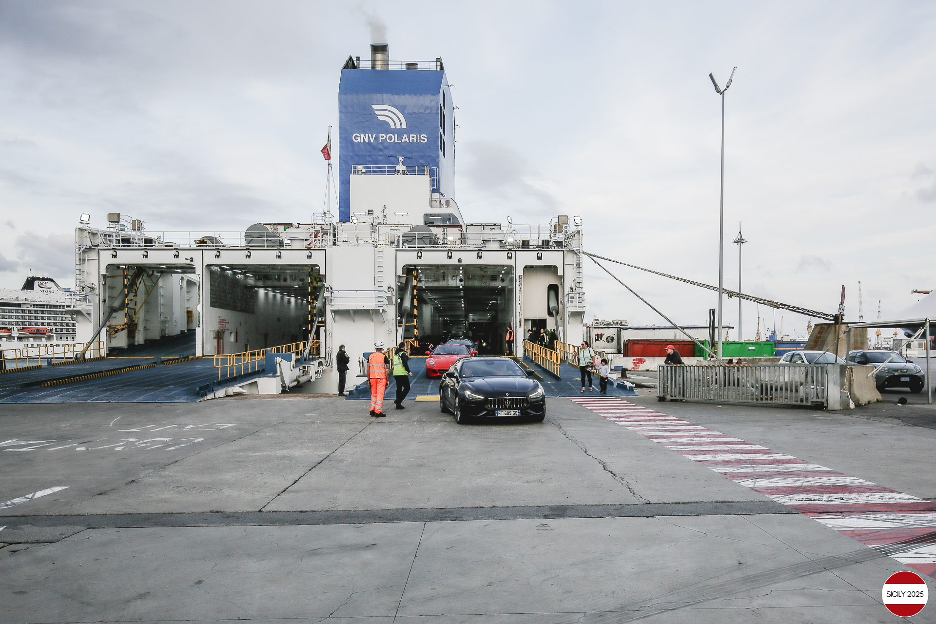 The cars disembark from the ship in Genoa. 