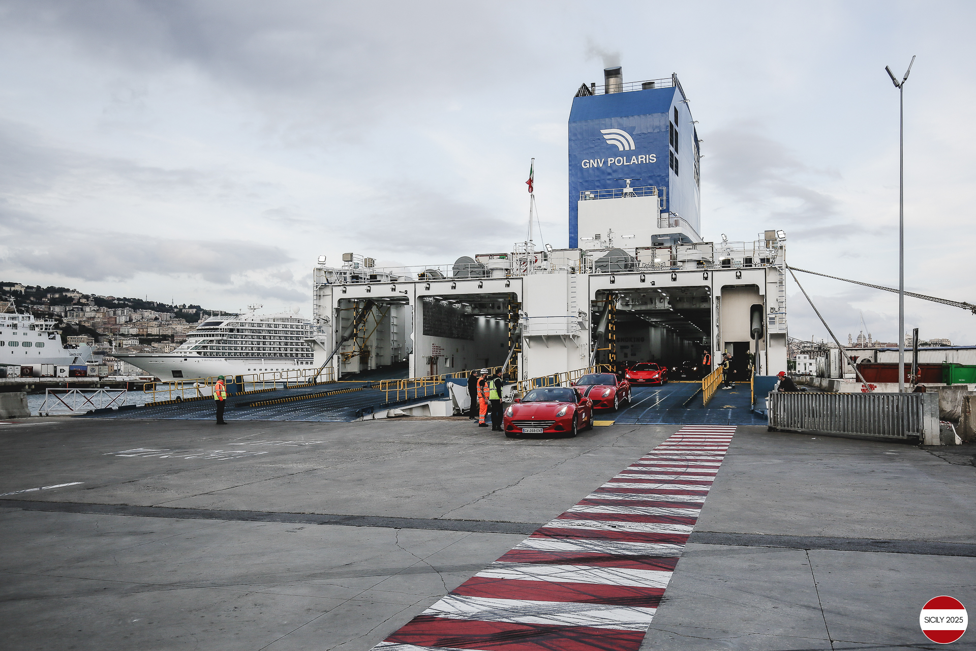 The cars disembark from the ship in Genoa. 