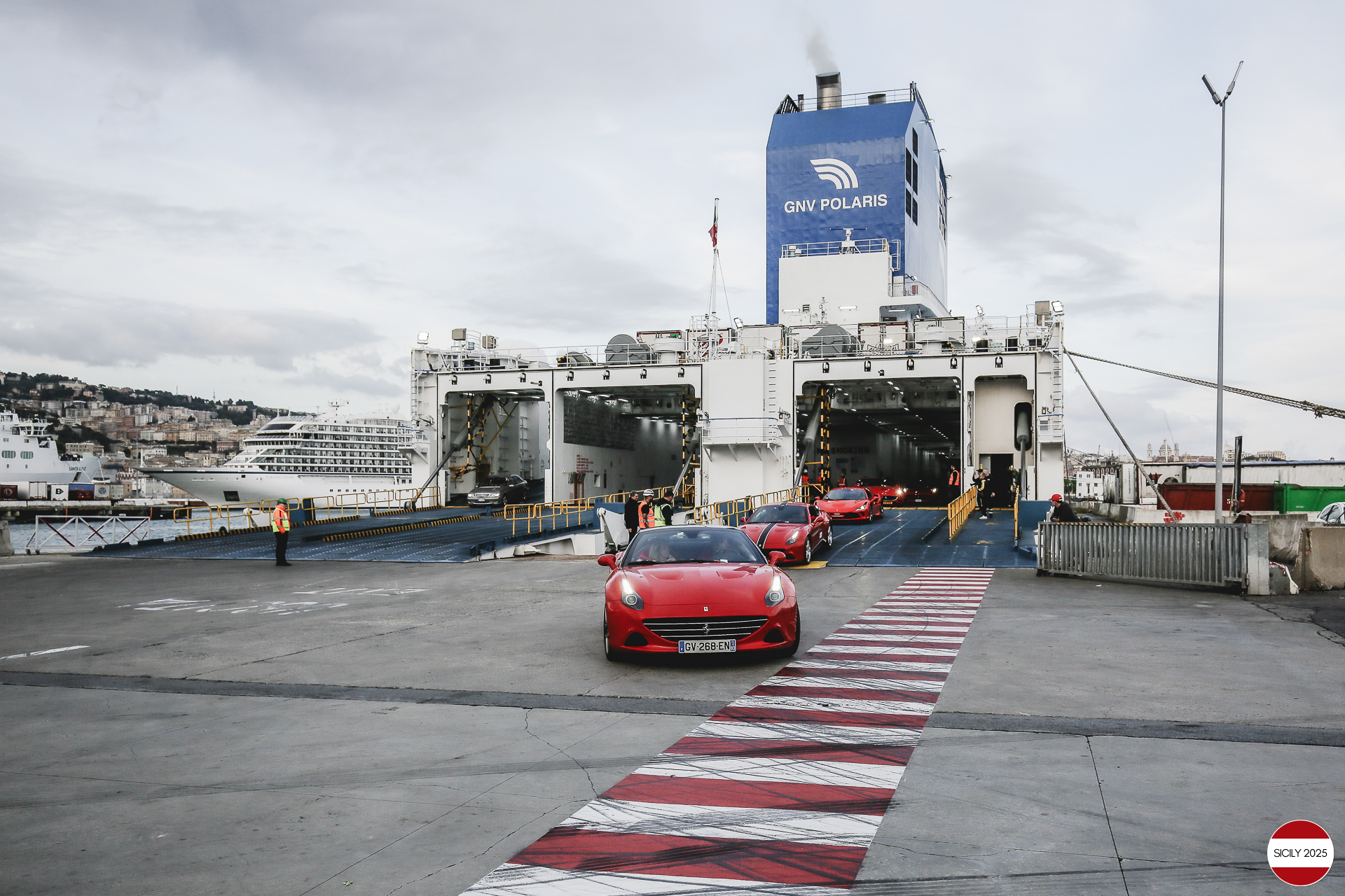 The cars disembark from the ship in Genoa.
