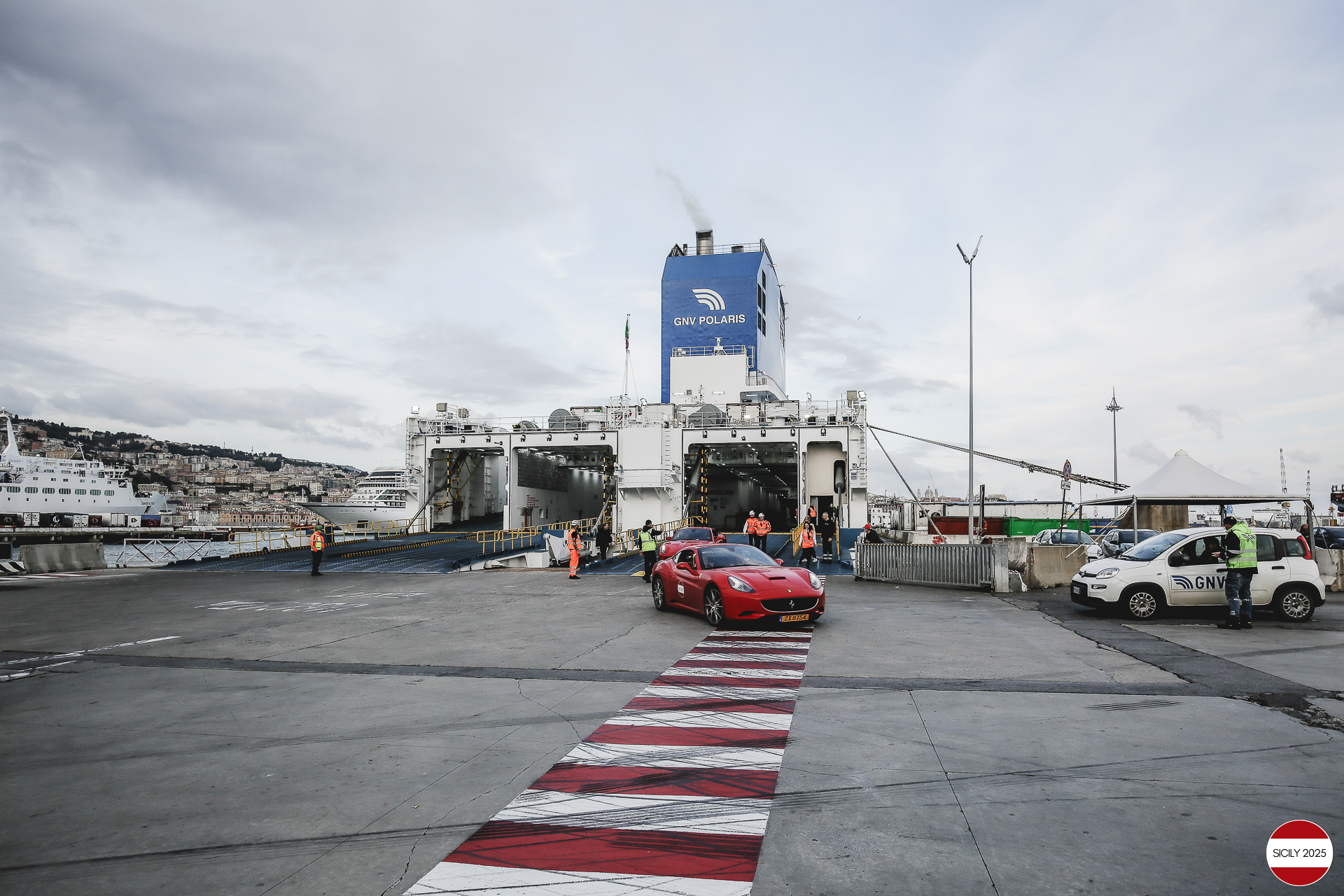 The cars disembark from the ship in Genoa. 