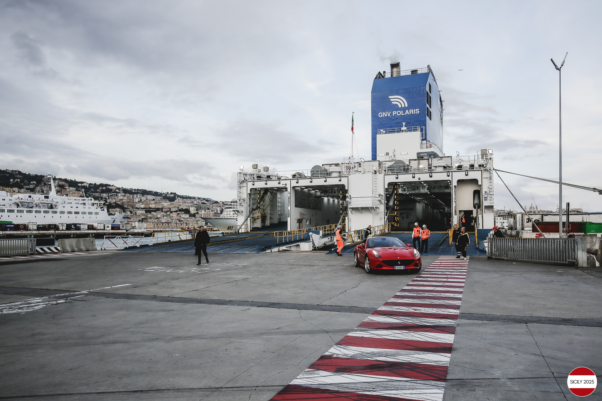 The cars disembark from the ship in Genoa. 