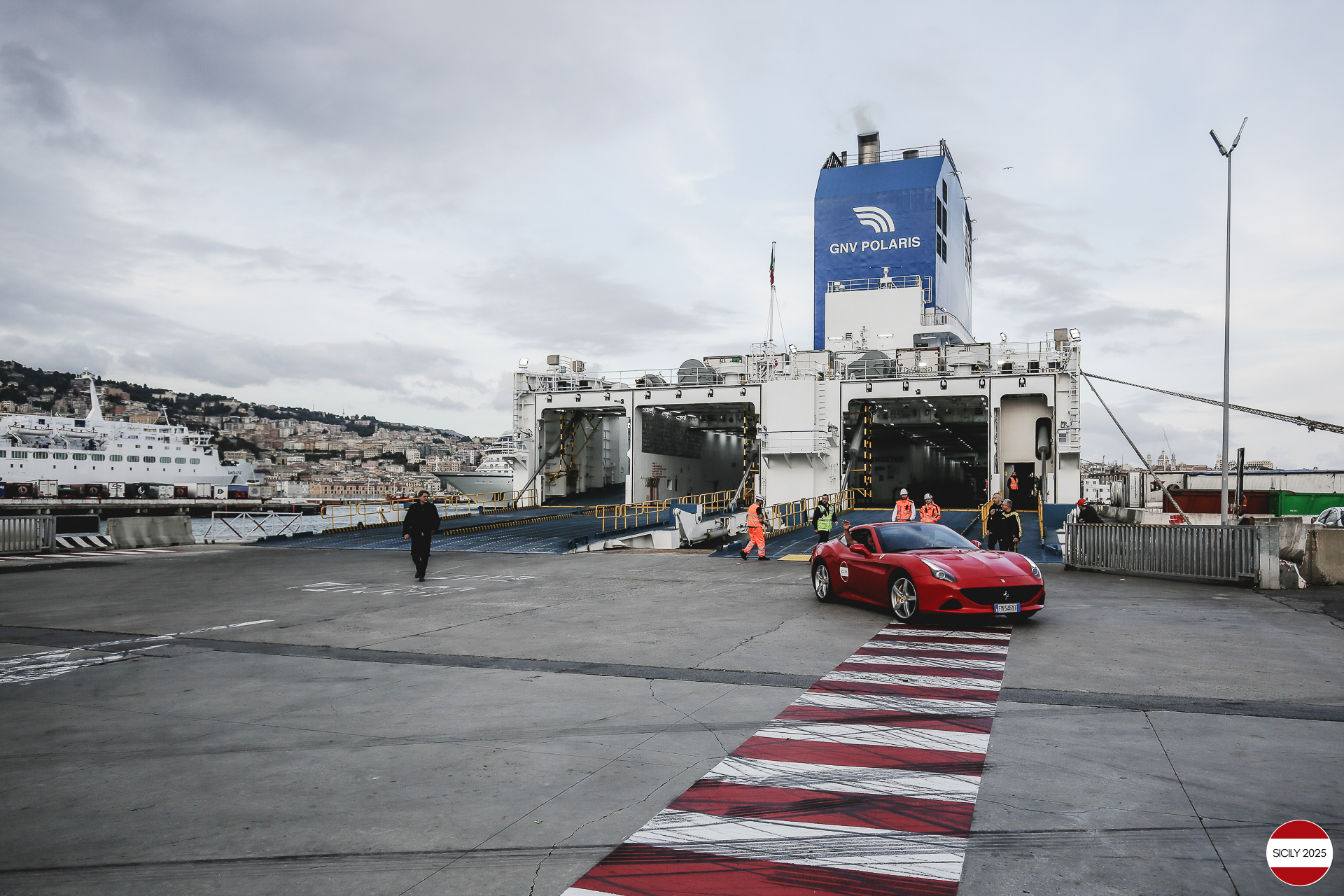 The cars disembark from the ship in Genoa. 