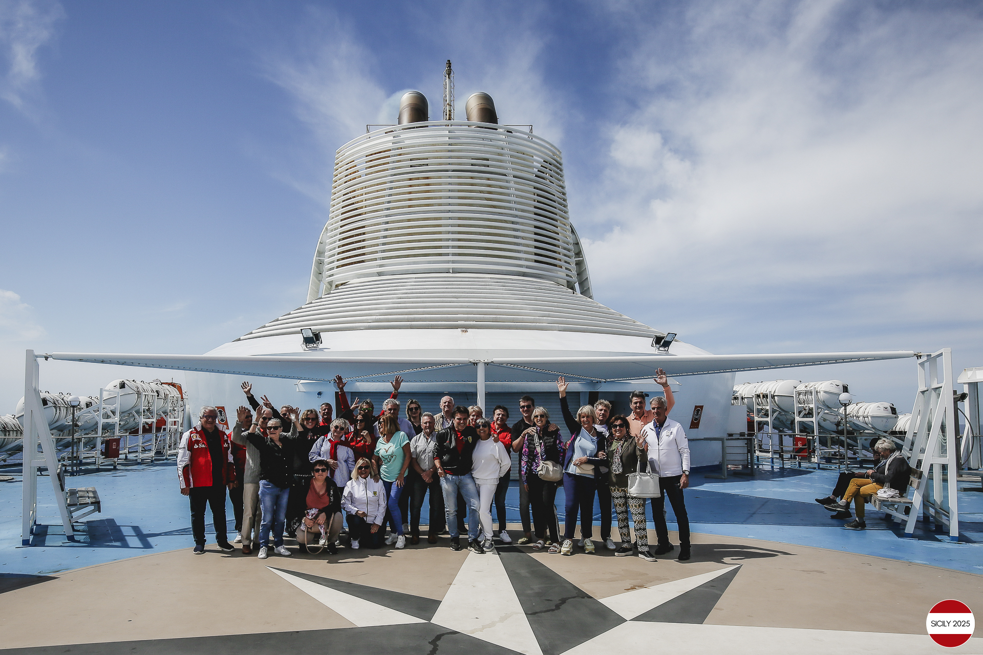 Ferrari drivers and their partners relax on the ship as it sails towards Palermo. 