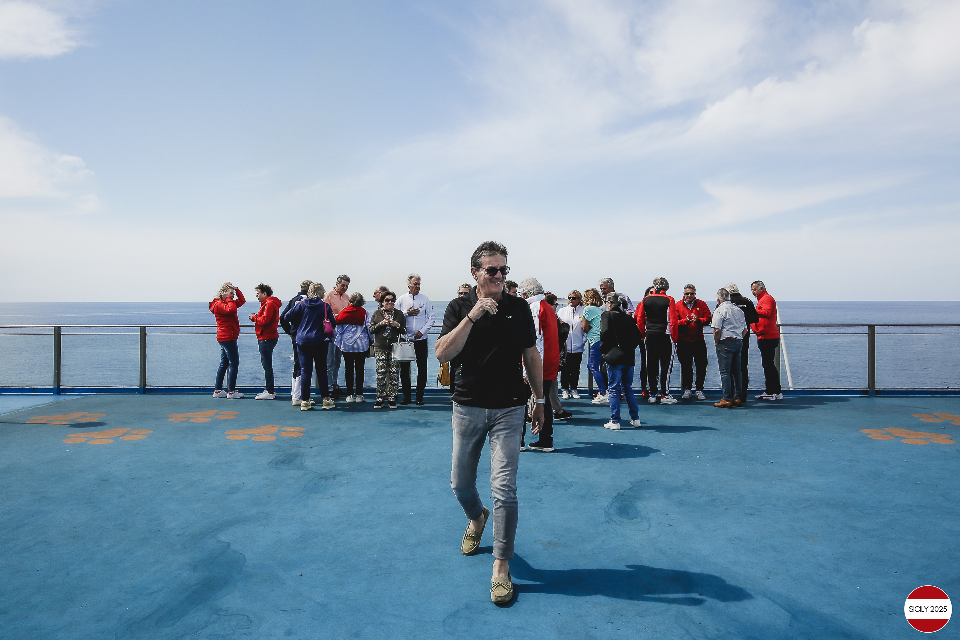Ferrari drivers and their partners relax on the ship as it sails towards Palermo. 