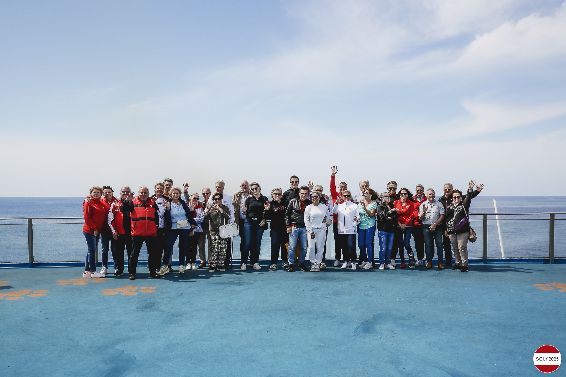 Ferrari drivers and their partners relax on the ship as it sails towards Palermo. 