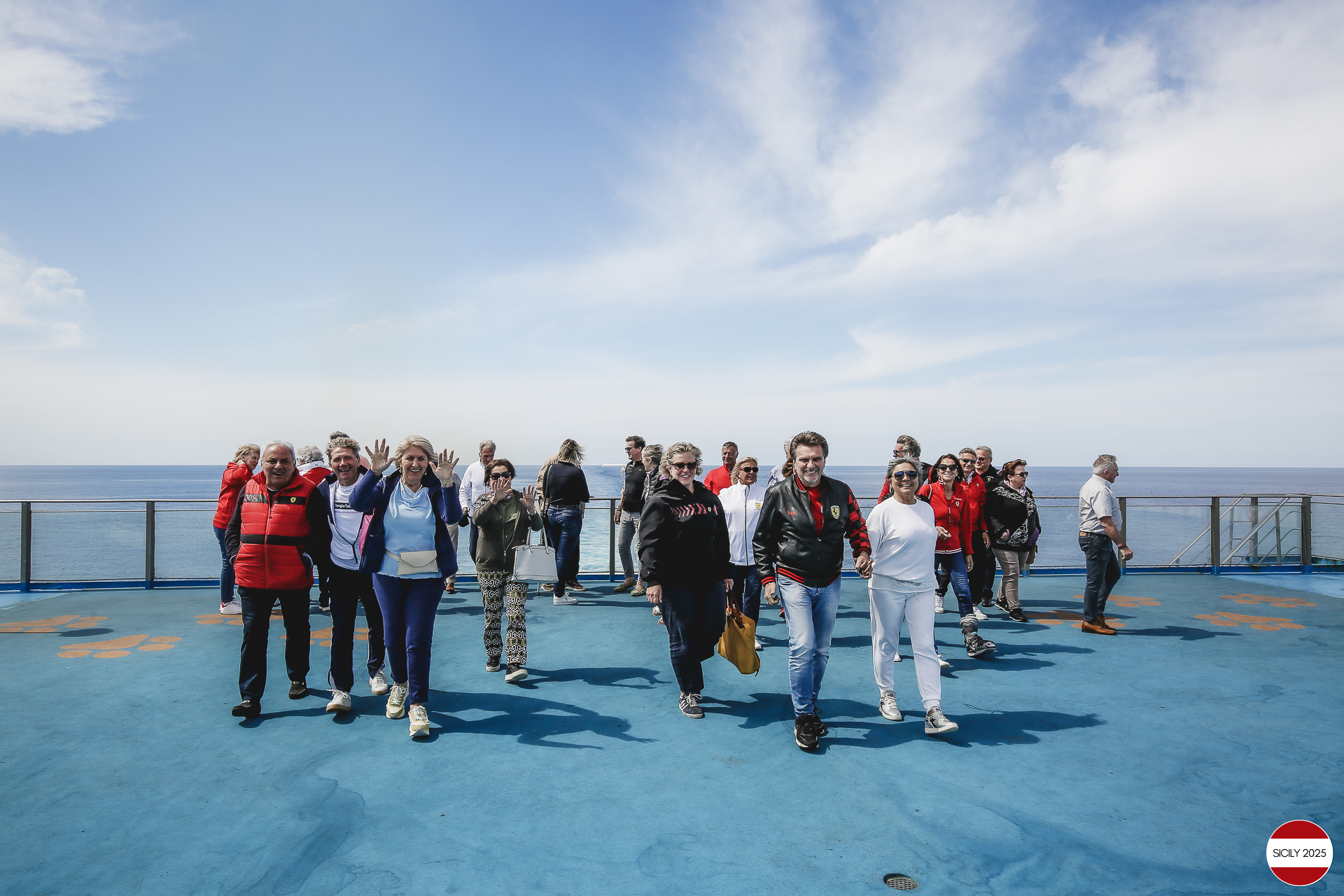 Ferrari drivers and their partners relax on the ship as it sails towards Palermo. 