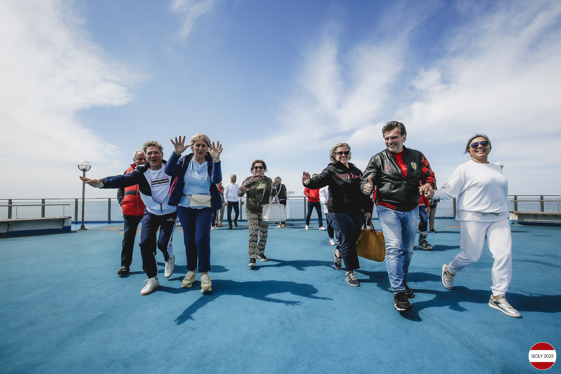 Ferrari drivers and their partners relax on the ship as it sails towards Palermo. 