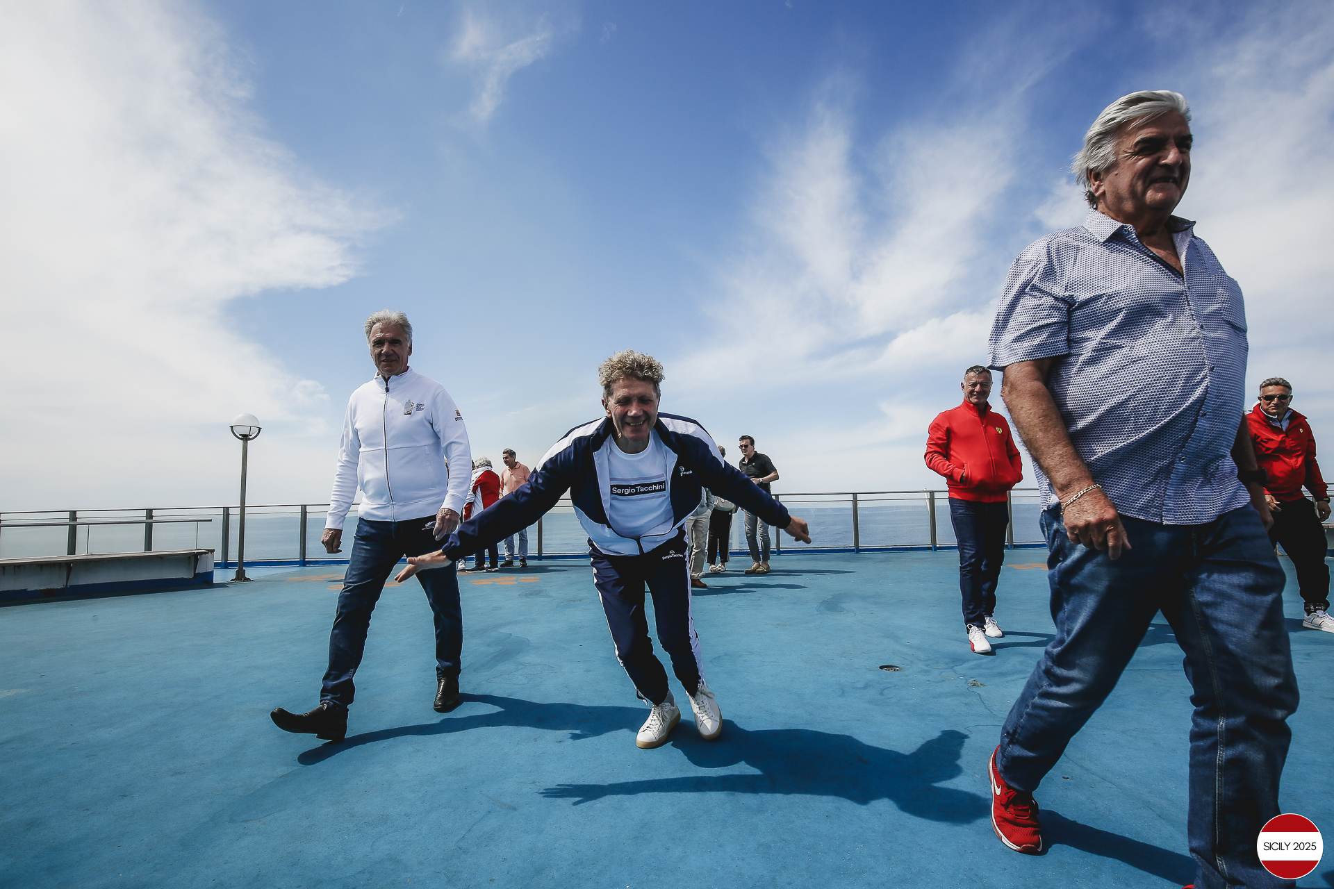 Ferrari drivers and their partners relax on the ship as it sails towards Palermo. 