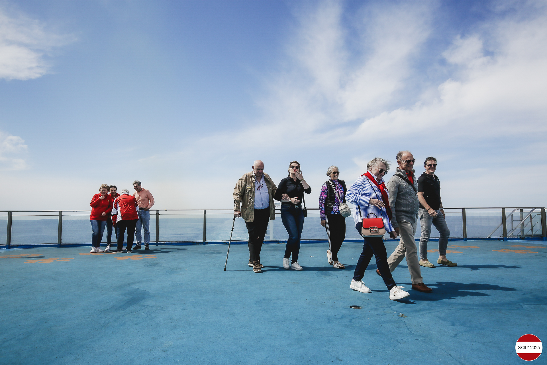 Ferrari drivers and their partners relax on the ship as it sails towards Palermo. 