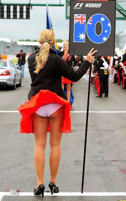 A grid girl on a windy day on 06 July 2008. 