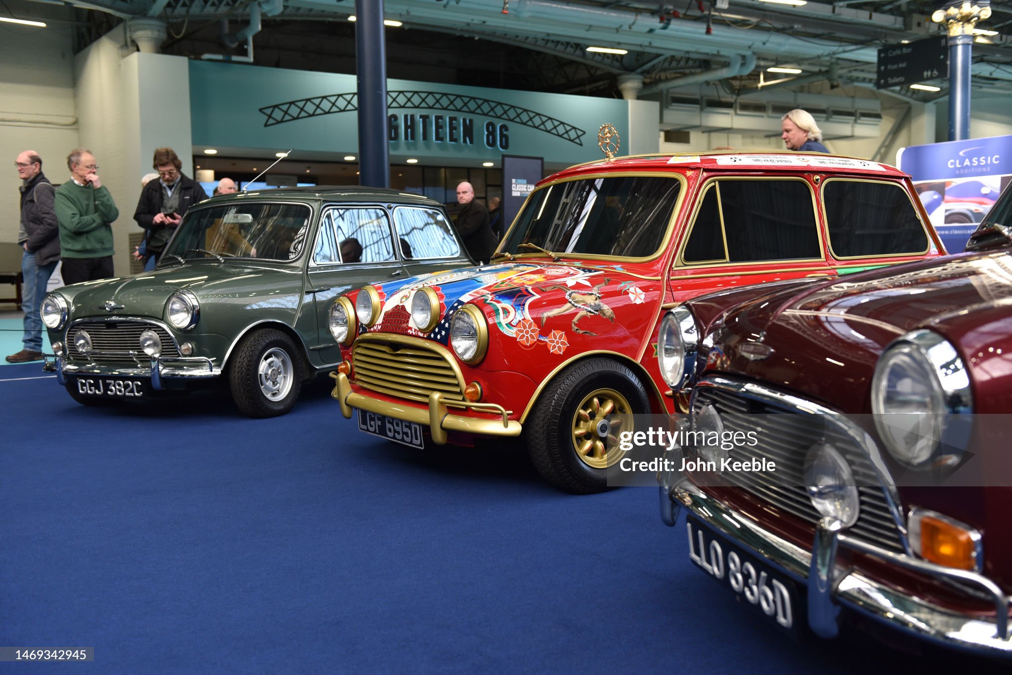 Paul McCartney's Radford Mini Cooper S de Ville (L), George Harrison's Mini Cooper S (C) and Ringo Starr's Mini Cooper S are displayed together at the London Classic Car show at Olympia London on February 24, 2023. 
