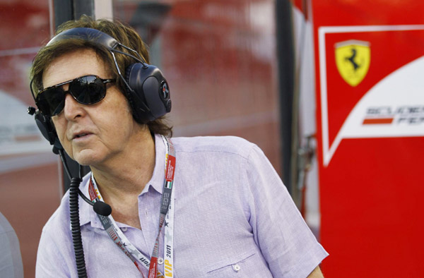 Paul McCartney watches from the pit during the qualifying session for the Abu Dhabi F1 Grand Prix at Yas Marina circuit on 12 November 2011. 