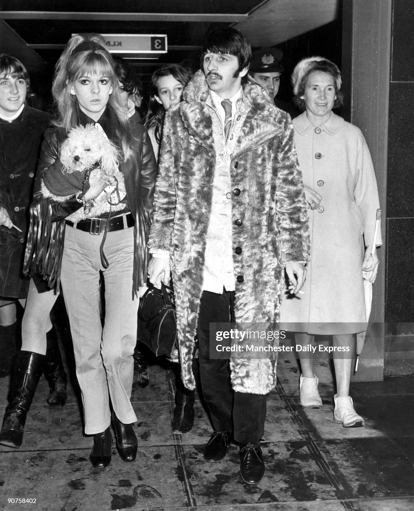 Beatles drummer Ringo Starr and his wife Maureen Cox at an airport on 01 August 1972. 