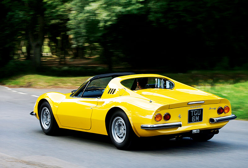 A yellow Ferrari Dino.