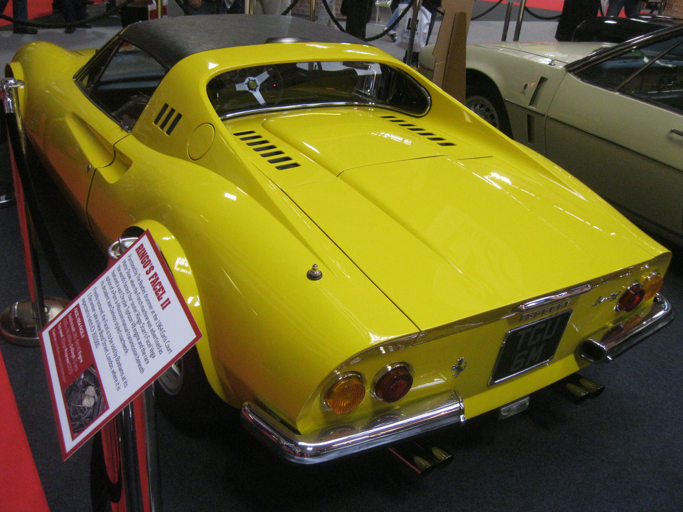 A yellow Ferrari Dino.