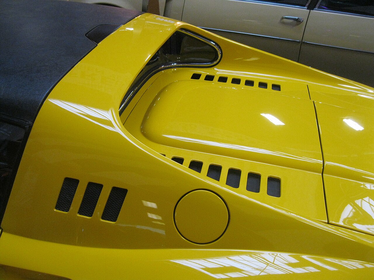 A yellow Ferrari Dino.