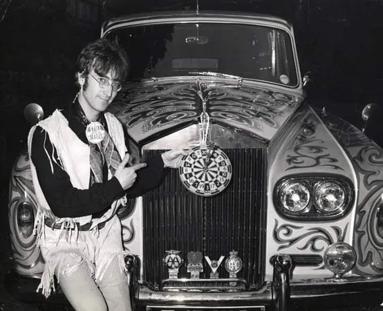 John Lennon and his 1965 Rolls Royce Phantom V.