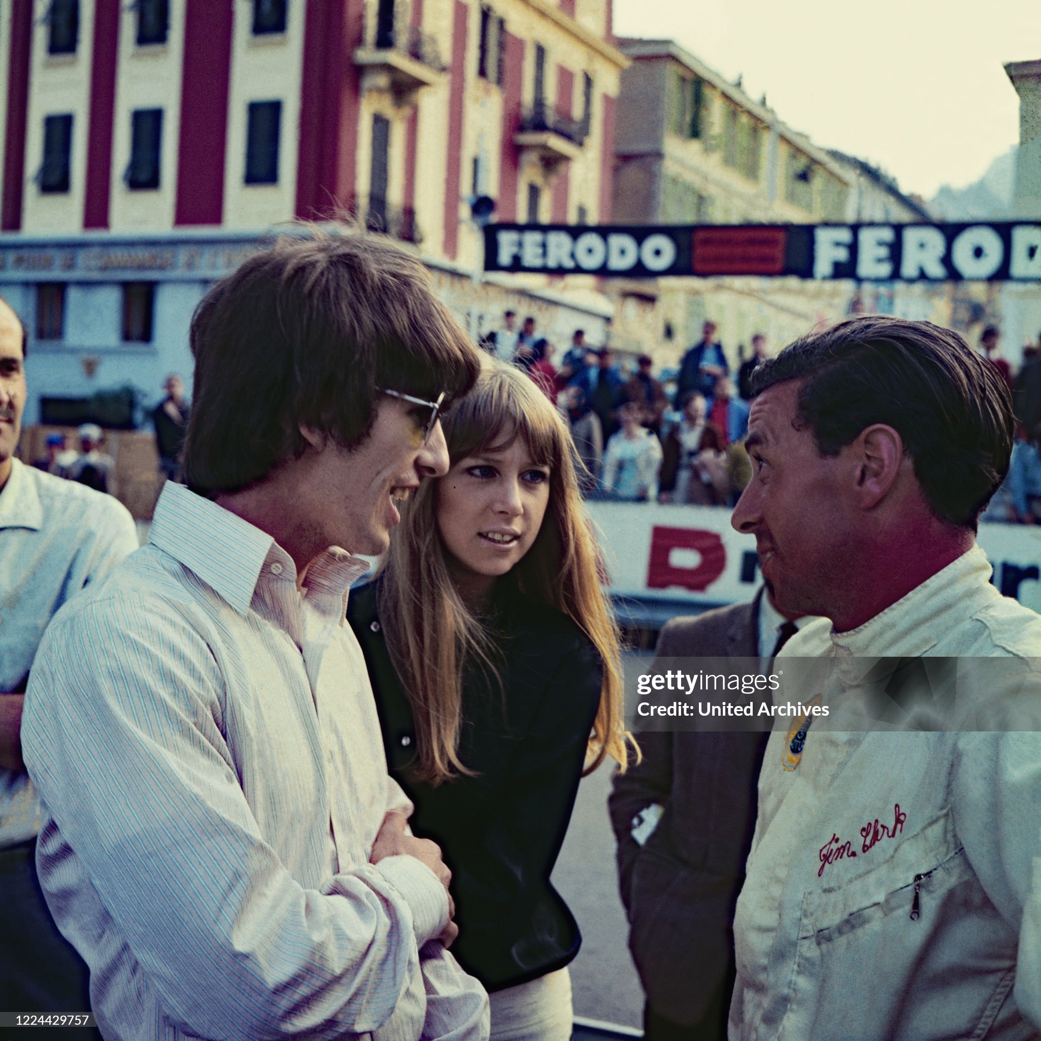George Harrison and Patricia Anne Pattie Boyd talking to racing driver Jim Clark while visiting Monte Carlo, Monaco, on 22 May 1966. 