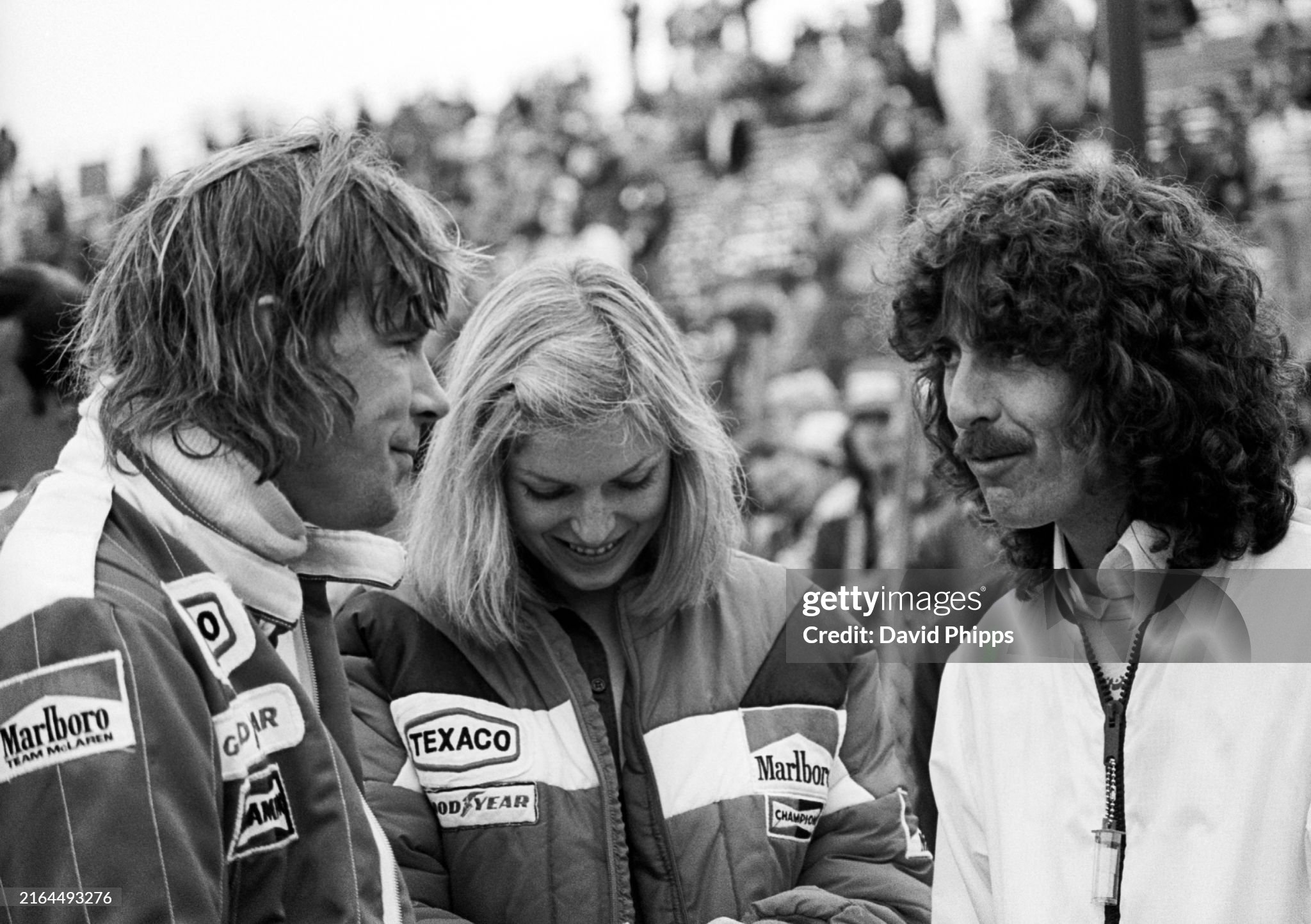 Seventh placed James Hunt with his girlfriend Jane Birbeck and George Harrison at the United States Grand Prix West in Long Beach on 03 April 1977. 