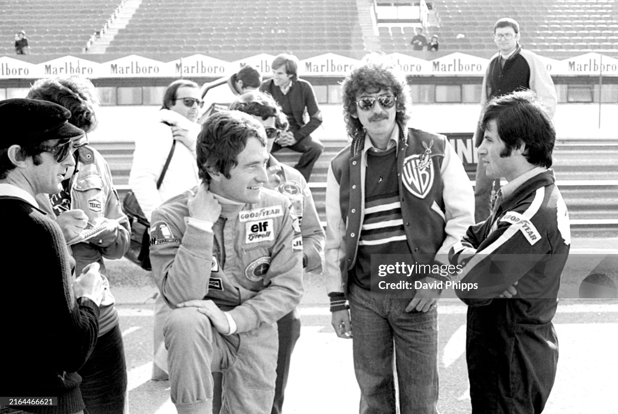Jackie Stewart, Patrick Depailler, Tyrrell and George Harrison, former Beatle, at the Spanish Grand Prix in Jarama on 08 May 1977. 