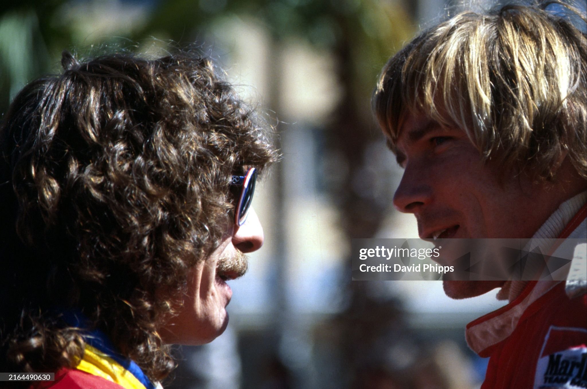 James Hunt, McLaren, talks with Beatles legend George Harrison at the United States Grand Prix West in Long Beach on 02 April 1978. 
