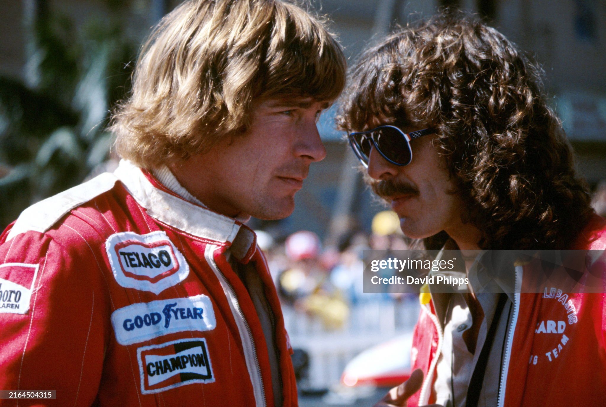 James Hunt, McLaren, talks with Beatles legend George Harrison at the United States Grand Prix West in Long Beach on 02 April 1978. 