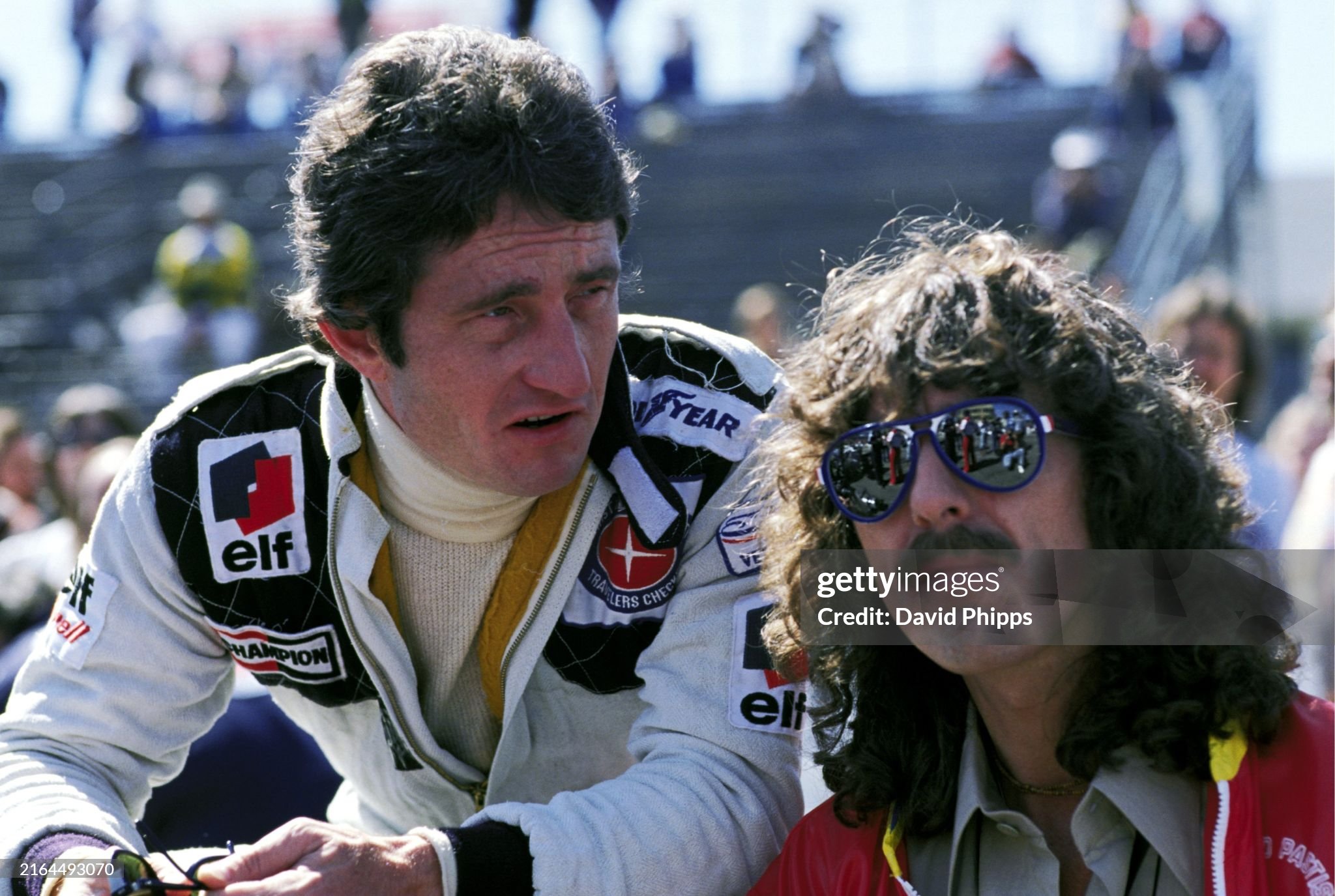Third placed Patrick Depailler, Tyrrell, talks with George Harrison, former Beatle and F1 fan, at the United States Grand Prix West in Long Beach on 02 April 1978. 